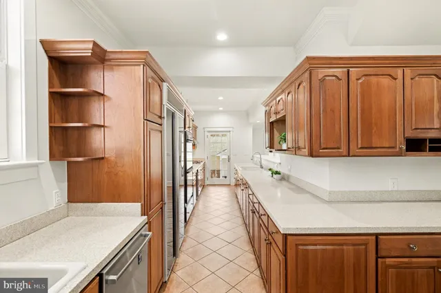 a hallway with a sink and a window