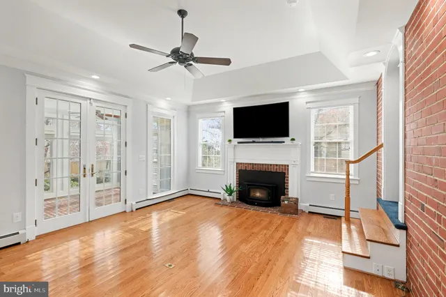a view of a room with cabinet flat screen tv and outdoor space