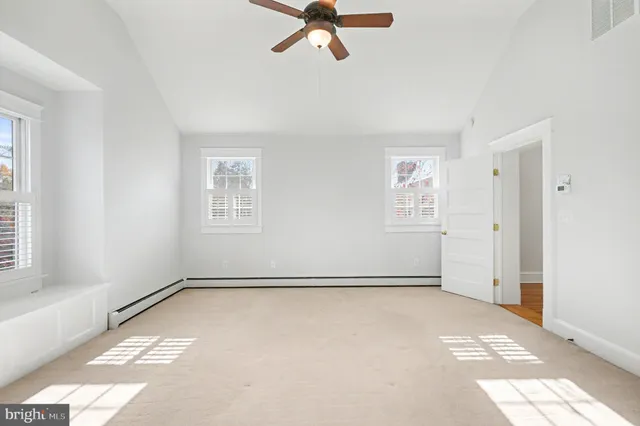 an empty room with fan