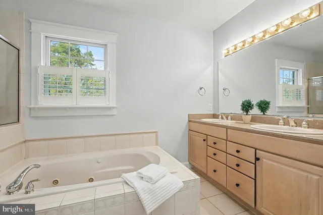 a bathroom with a tub and a window