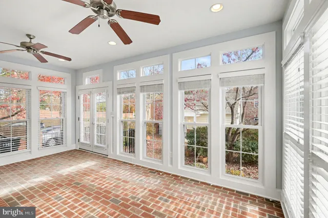 a view of an entryway with wooden floor