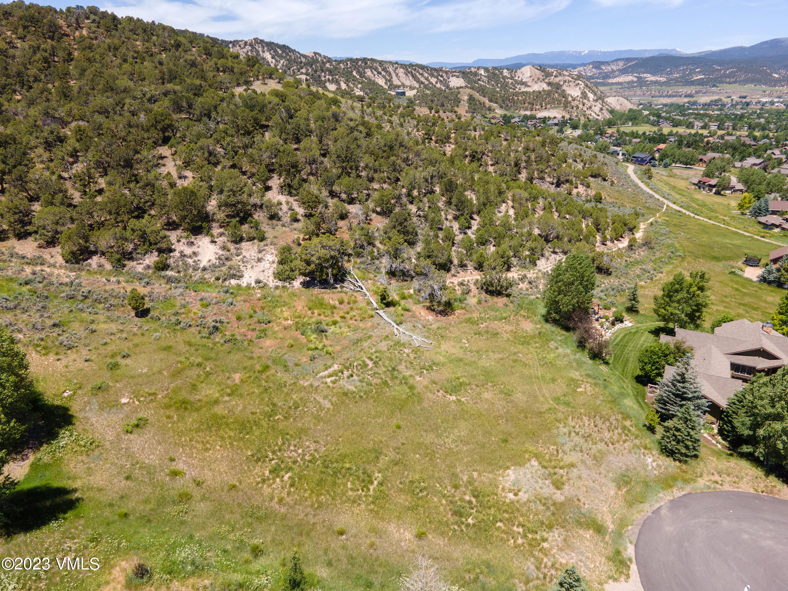 58 Lone Spur Eagle, CO 81631 - Photo 17 of 22 a view of a field with trees in the background