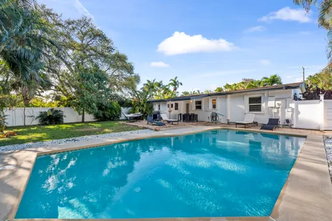 a view of a house with swimming pool