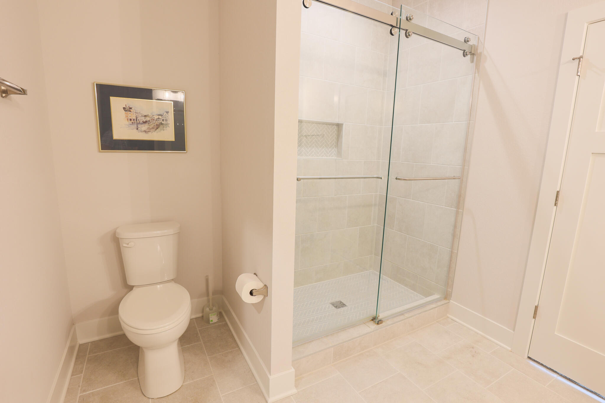 N28W25158 Pkwy Rdg Circle, Unit B Pewaukee, WI 53072 - Photo 39 of 86 Primary Bathroom with Dual Sink, Tile Shower, Tile Floor, and Walk in Closet