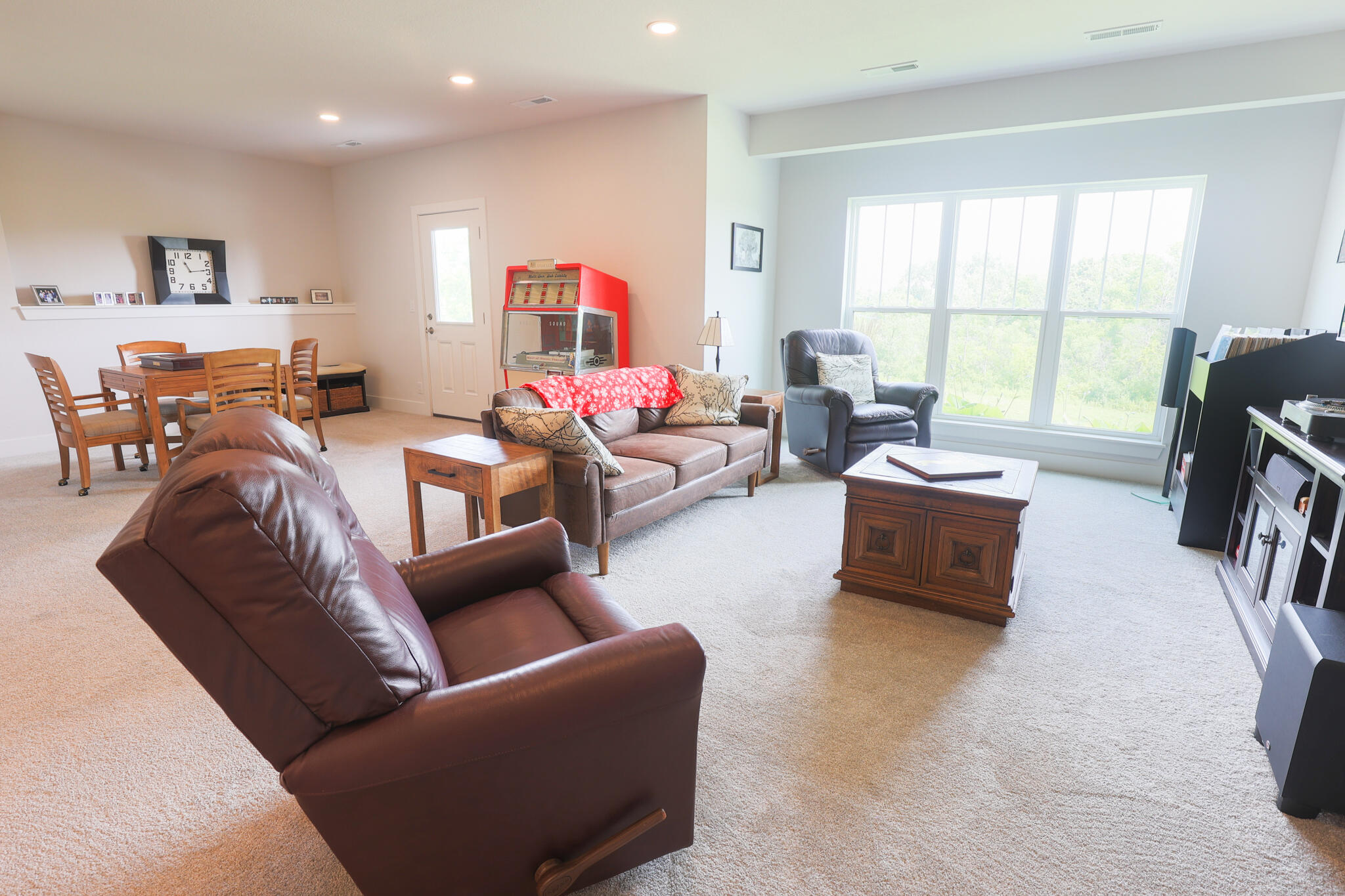 N28W25158 Pkwy Rdg Circle, Unit B Pewaukee, WI 53072 - Photo 53 of 86 Rec Room Lower Level with Exposed Wall and Walk Out to Patio