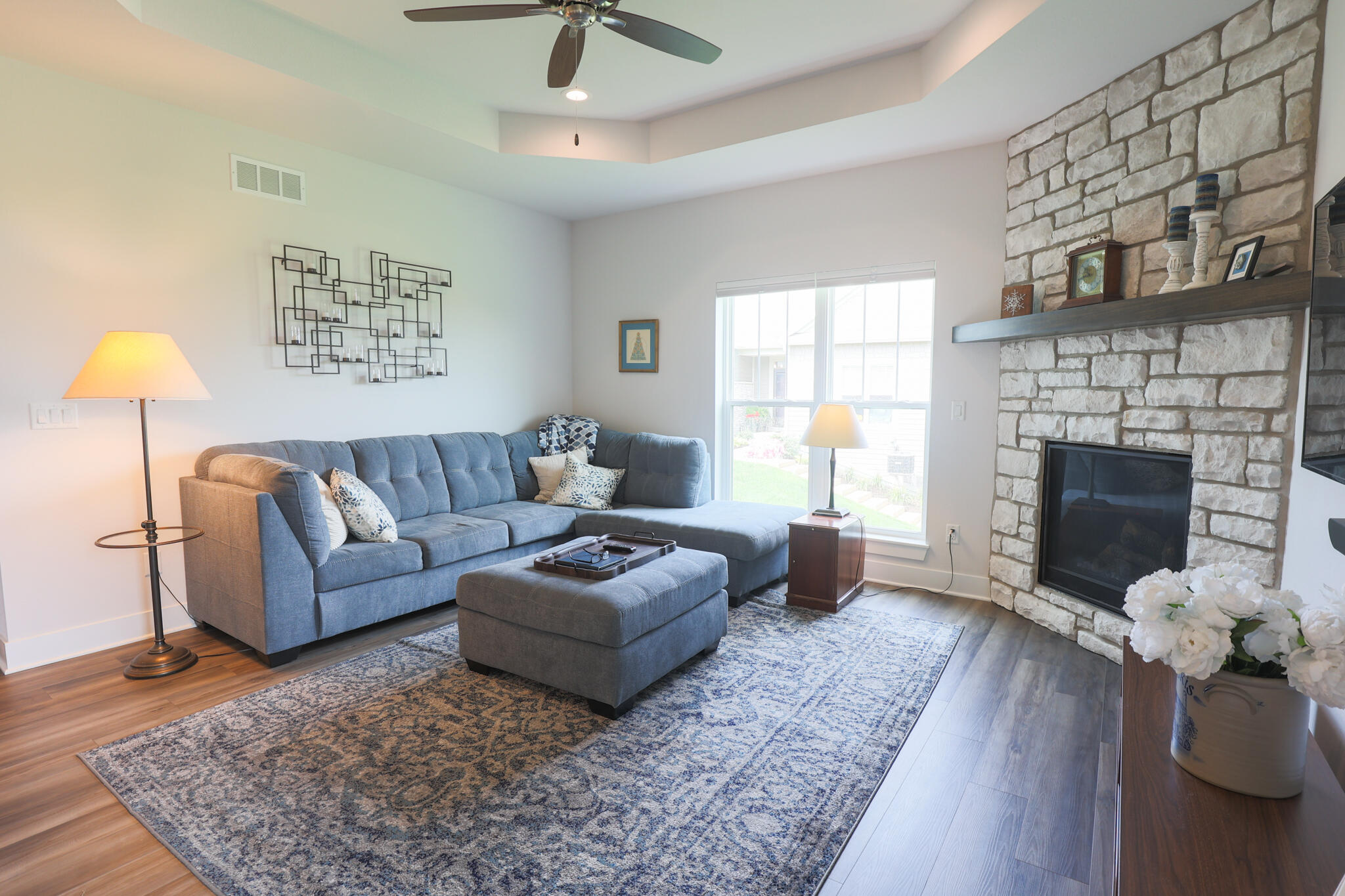 N28W25158 Pkwy Rdg Circle, Unit B Pewaukee, WI 53072 - Photo 6 of 86 Great room with floor to ceiling fireplace and door to balcony