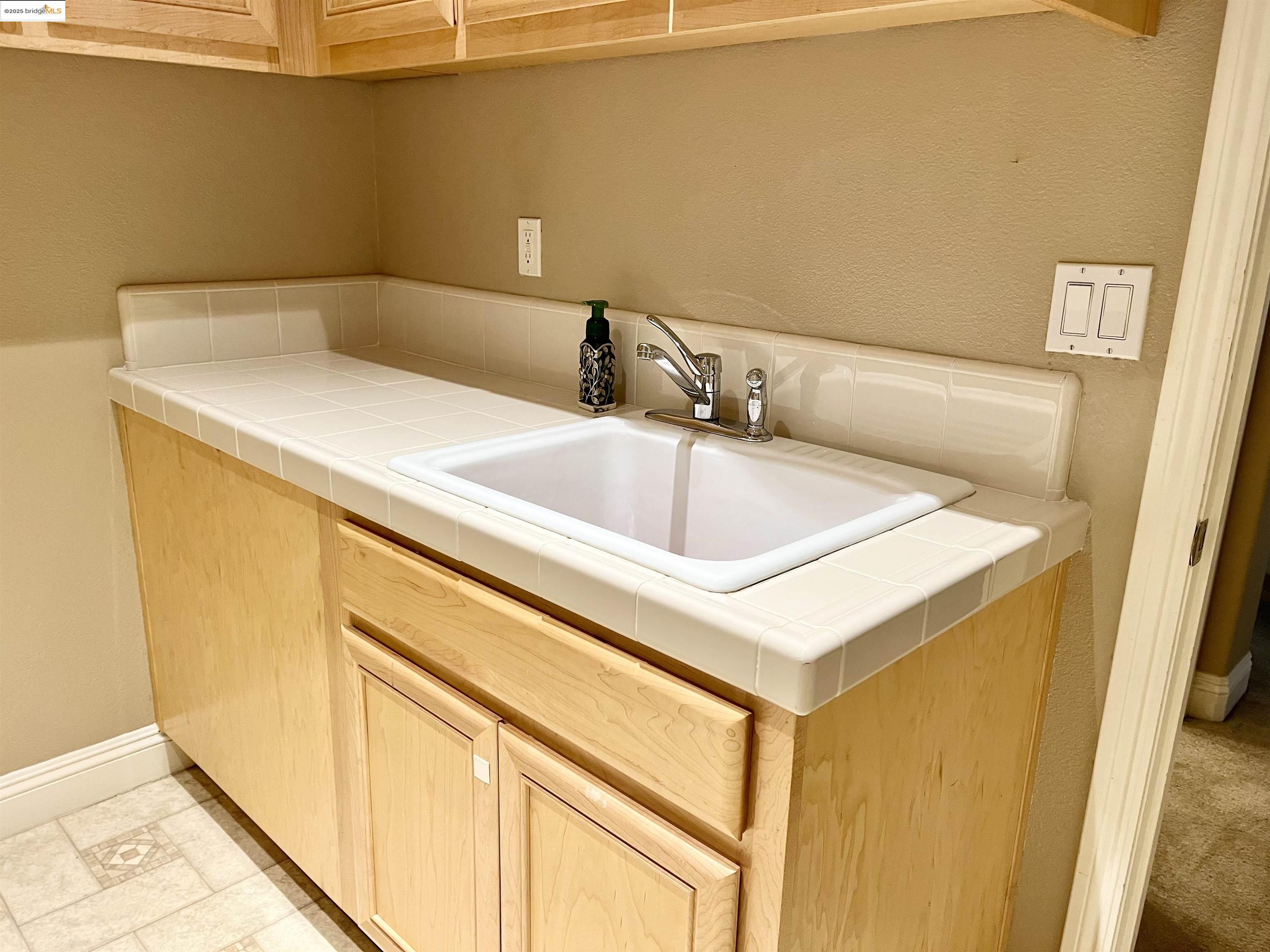 2497 Winged Foot Road Brentwood, CA 94513 - Photo 16 of 16 a bathroom with a sink and a bathtub