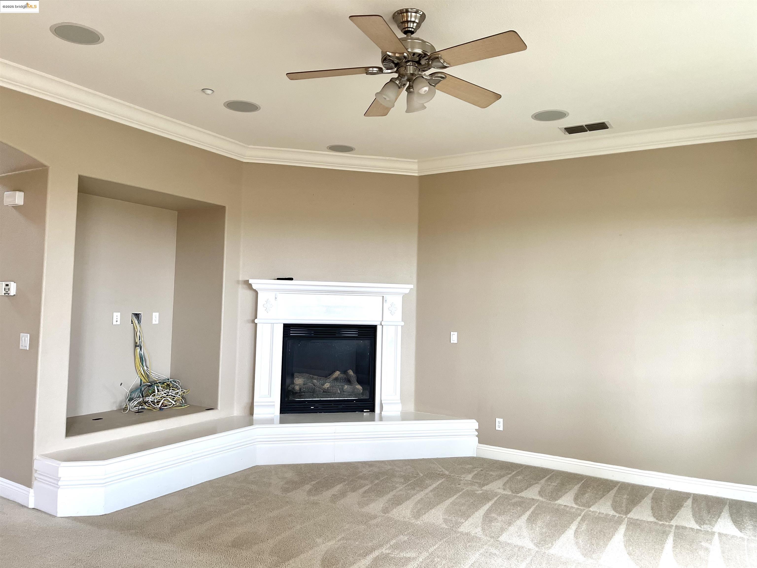 2497 Winged Foot Road Brentwood, CA 94513 - Photo 7 of 16 a view of an empty room with a fireplace
