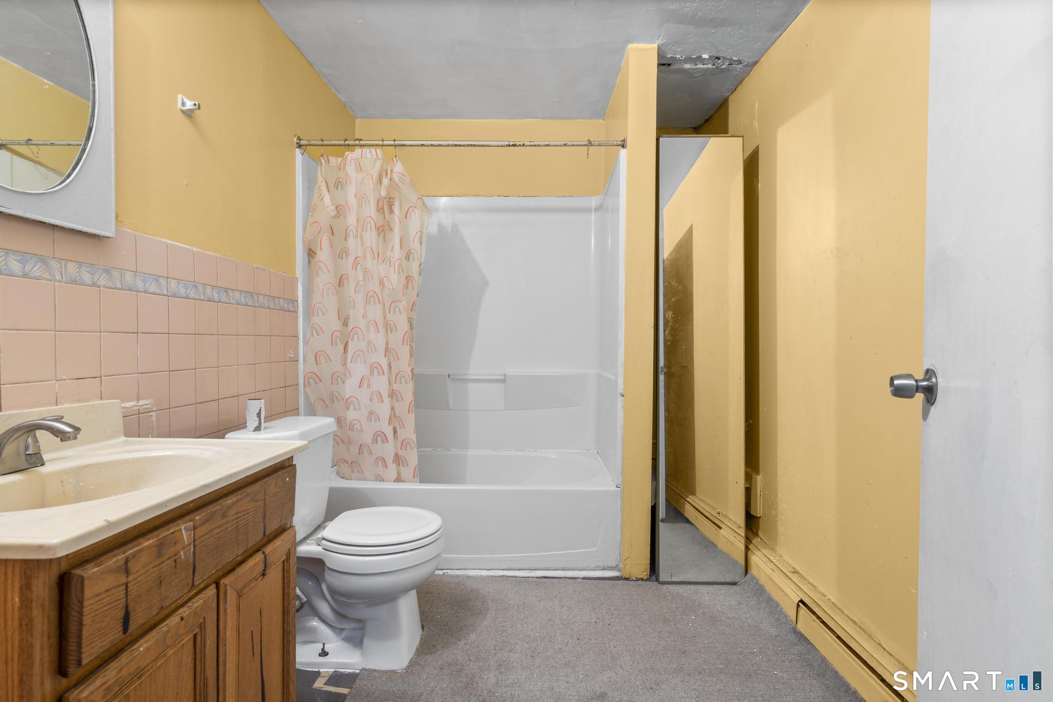 349 Noble Avenue Bridgeport, CT 06608 - Photo 18 of 33 a bathroom with a sink a toilet and shower