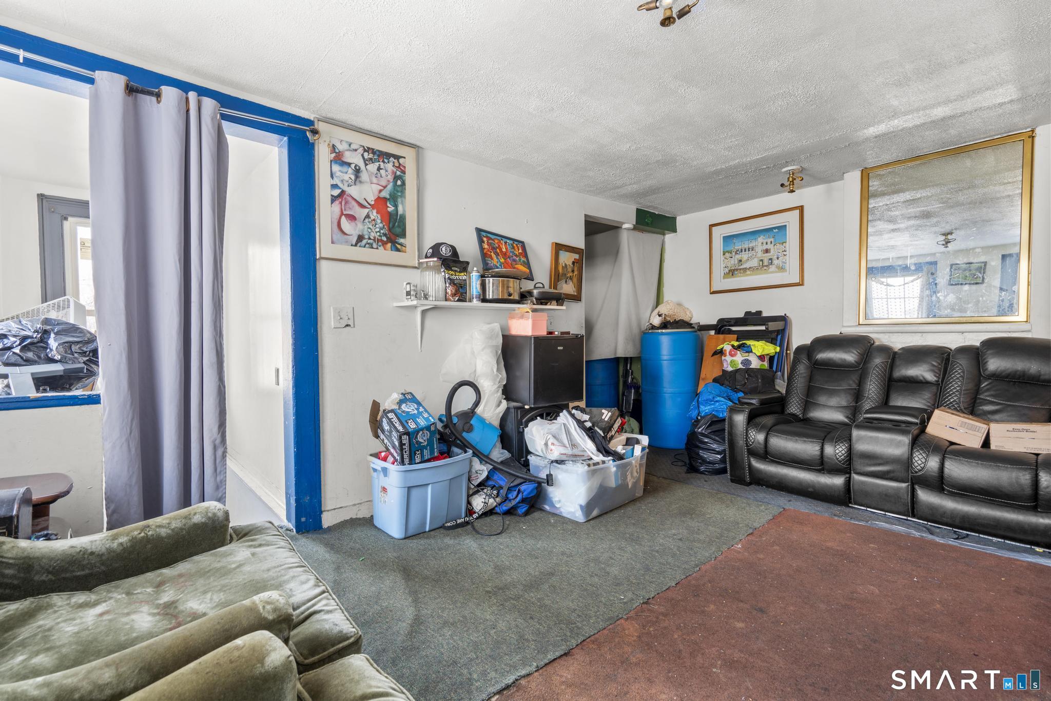 349 Noble Avenue Bridgeport, CT 06608 - Photo 25 of 33 a living room with furniture and a window