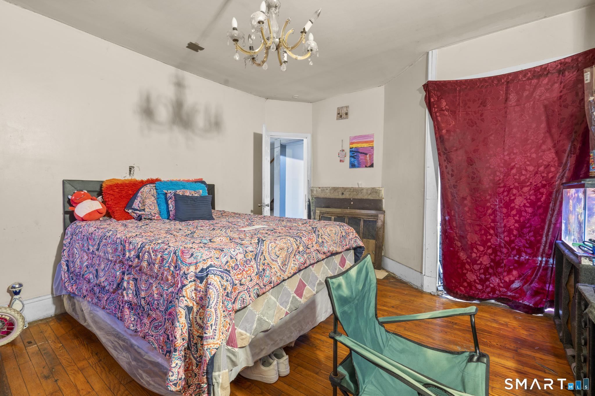 349 Noble Avenue Bridgeport, CT 06608 - Photo 29 of 33 a bedroom with a bed and a dresser
