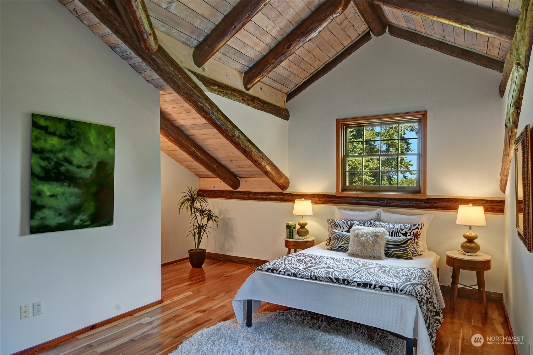 18724 High Rock Road Monroe, WA 98272 - Photo 13 of 39 a bedroom with a bed and wooden floor