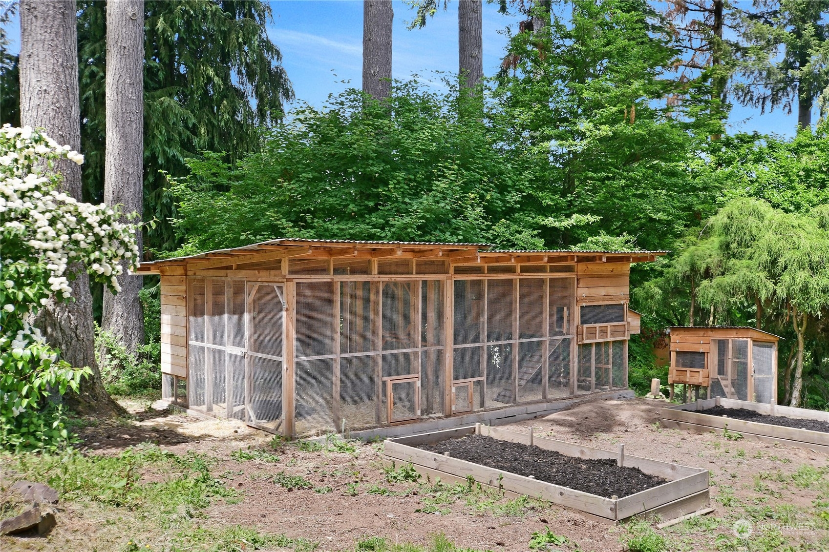 18724 High Rock Road Monroe, WA 98272 - Photo 26 of 39 a front view of a house with a yard and garage