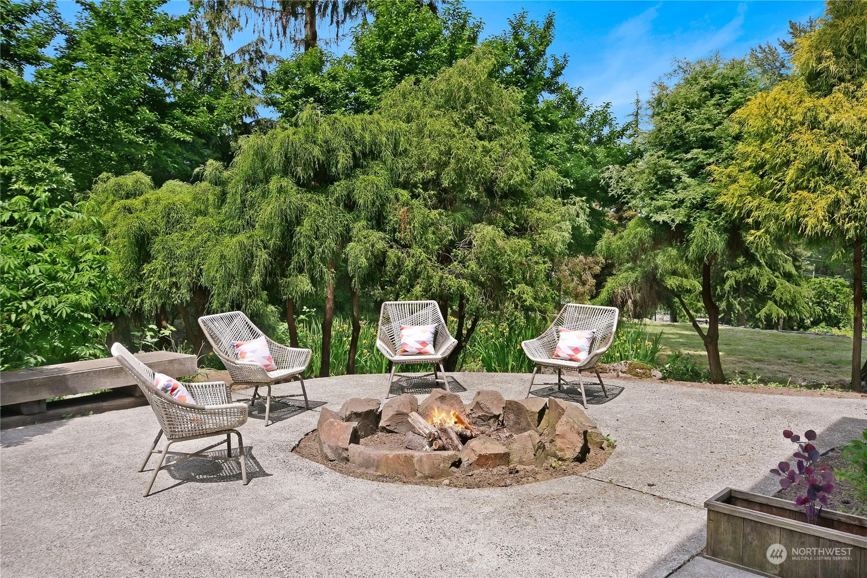 18724 High Rock Road Monroe, WA 98272 - Photo 27 of 39 a view of a chairs and fire pit in a backyard