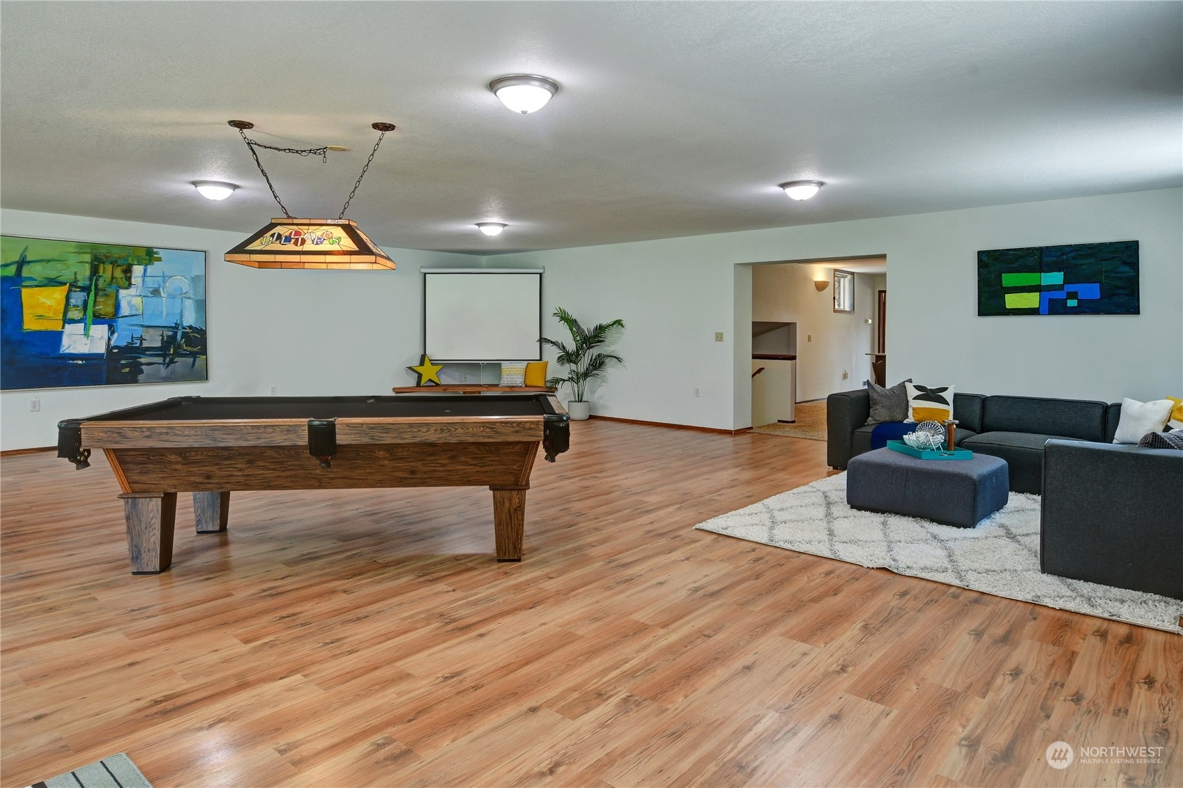 18724 High Rock Road Monroe, WA 98272 - Photo 32 of 39 a living room with furniture and a wooden floor