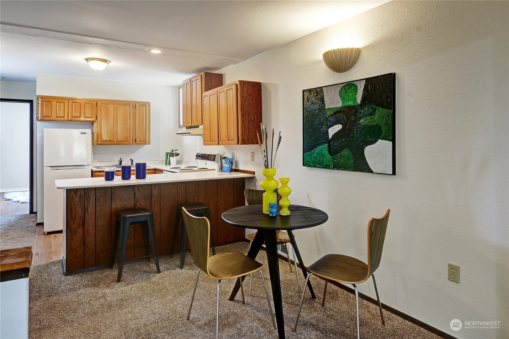 18724 High Rock Road Monroe, WA 98272 - Photo 33 of 39 a kitchen with stainless steel appliances a dining table chairs and a microwave
