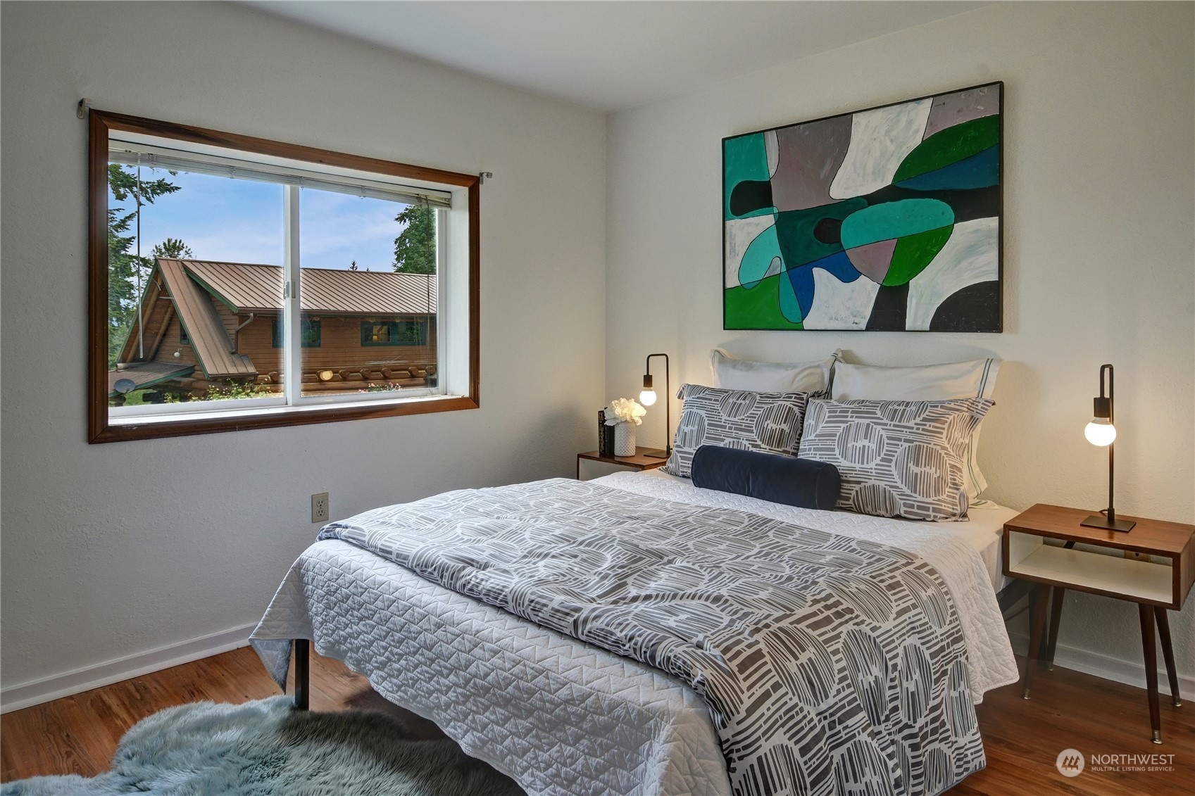 18724 High Rock Road Monroe, WA 98272 - Photo 35 of 39 a bedroom with a bed and a painting on the wall