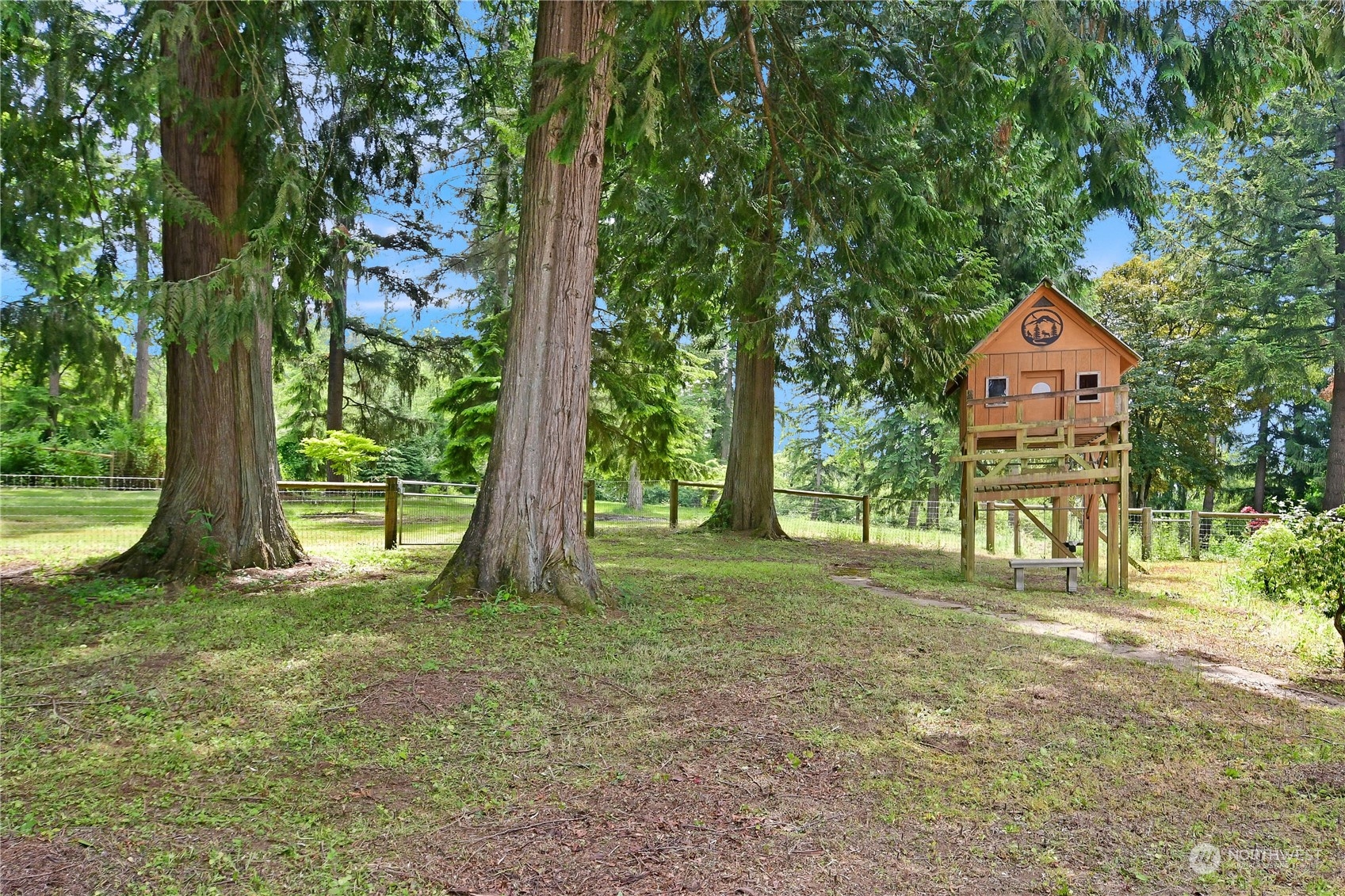 18724 High Rock Road Monroe, WA 98272 - Photo 37 of 39 a backyard of a house with lots of green space