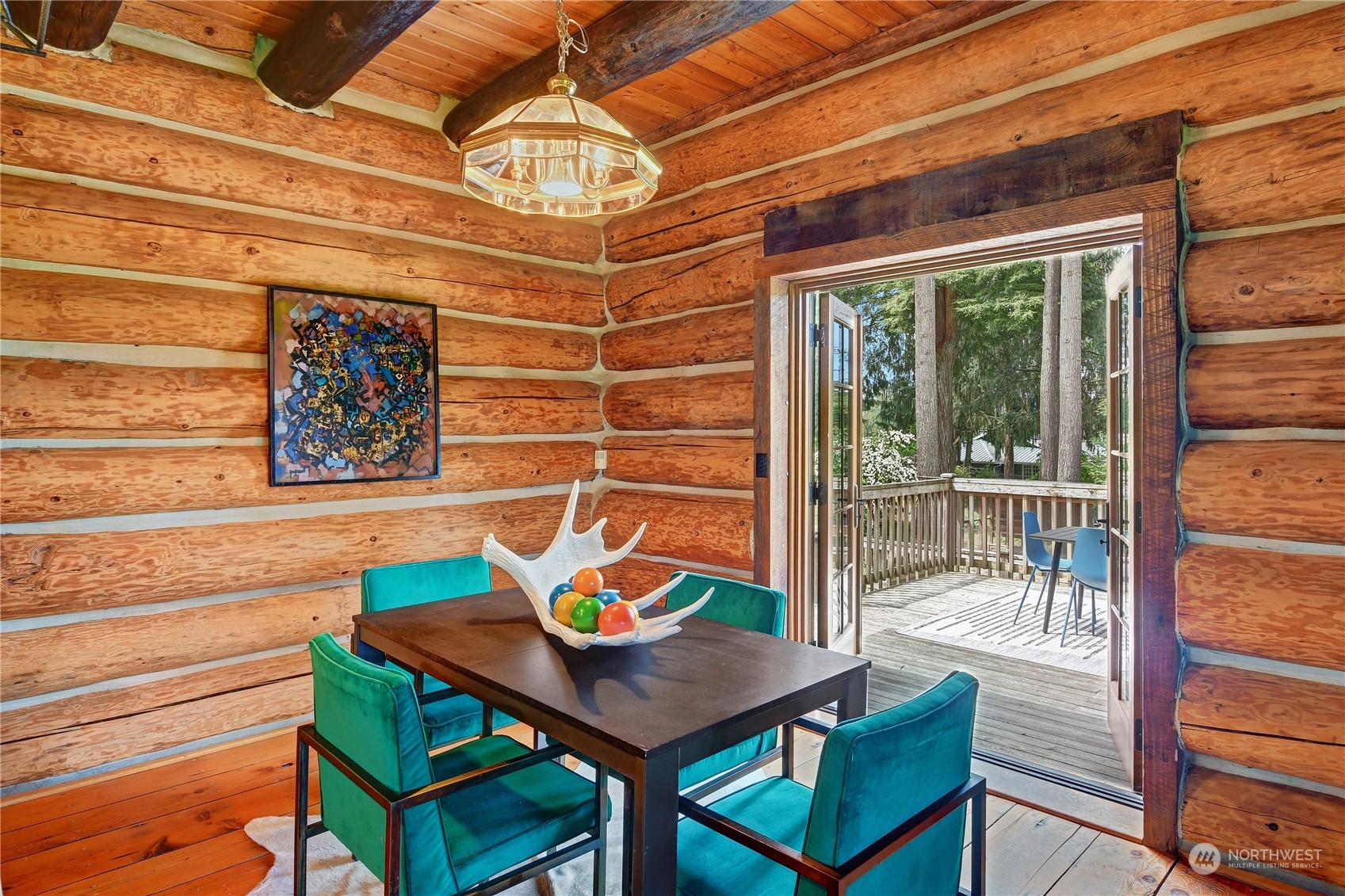 18724 High Rock Road Monroe, WA 98272 - Photo 6 of 39 a view of a dining room with furniture a chandelier and wooden floor