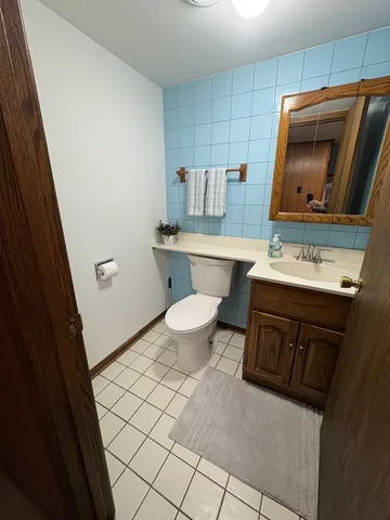 a kitchen with a sink toilet and microwave