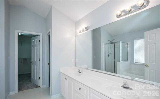815 Knightsbridge Road Fort Mill, SC 29708 - Photo 24 of 30 a spacious bathroom with a shower sink and mirror