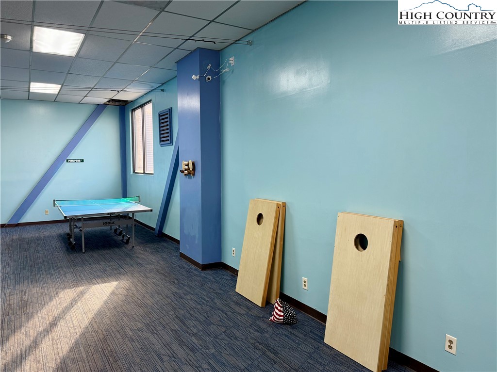 301 Pinnacle Inn Road, Unit 4303 Beech Mountain, NC 28604 - Photo 33 of 37 a view of an empty room with wooden floor and a window