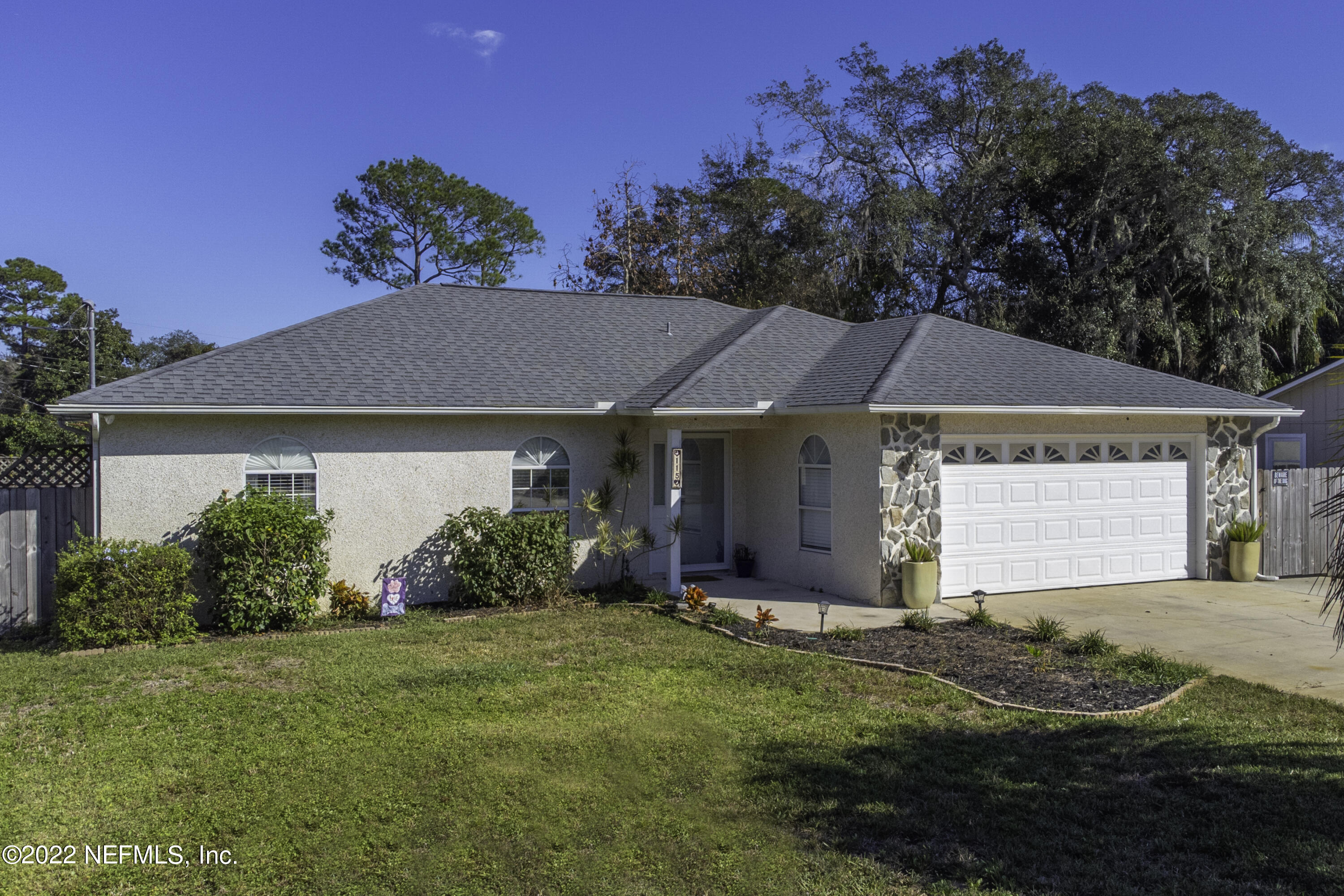 115 Nautilus Road St. Augustine, FL 32086 - Photo 1 of 23 a front view of house with yard and green space