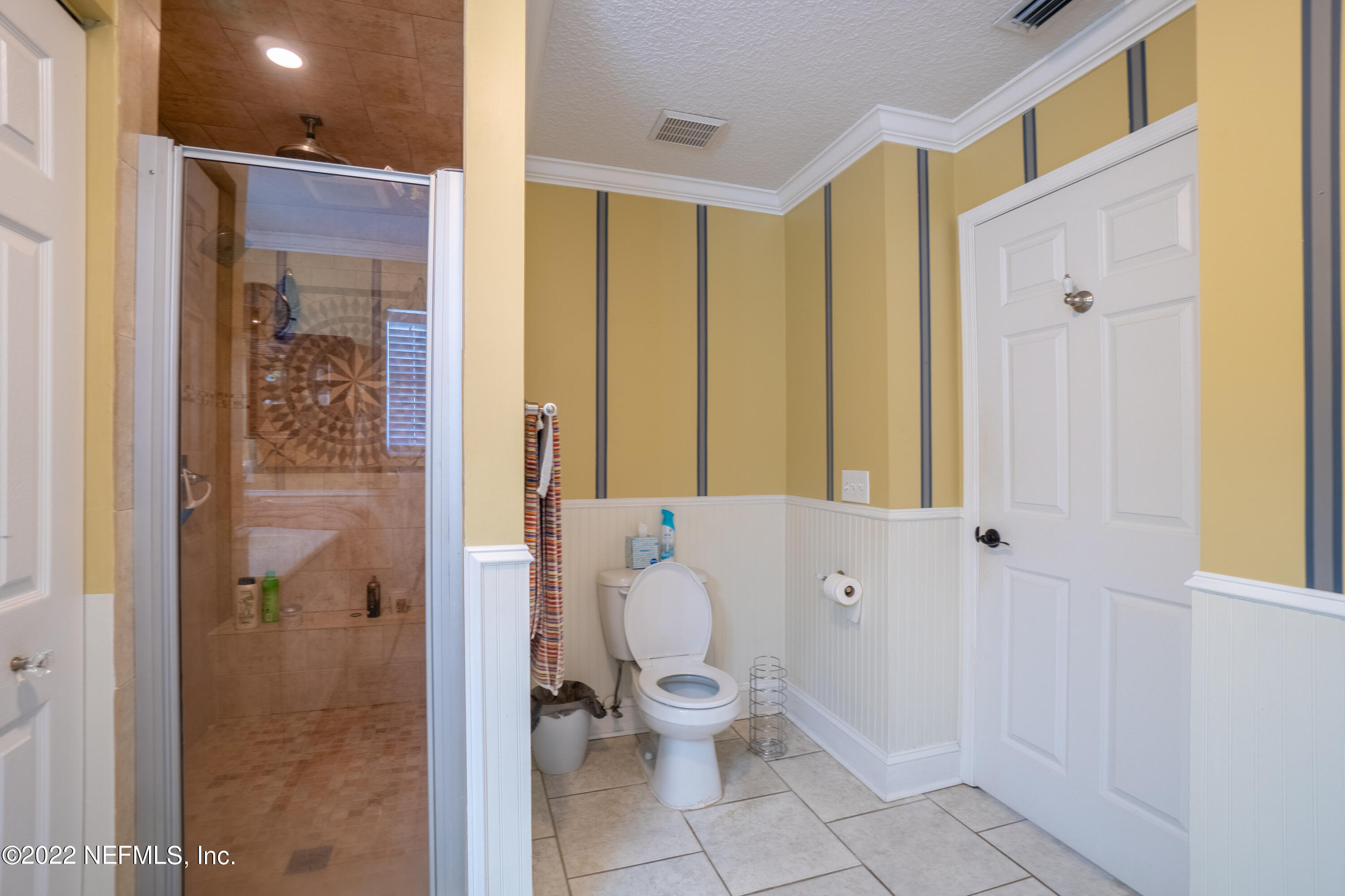 115 Nautilus Road St. Augustine, FL 32086 - Photo 11 of 23 a bathroom with a toilet sink and shower