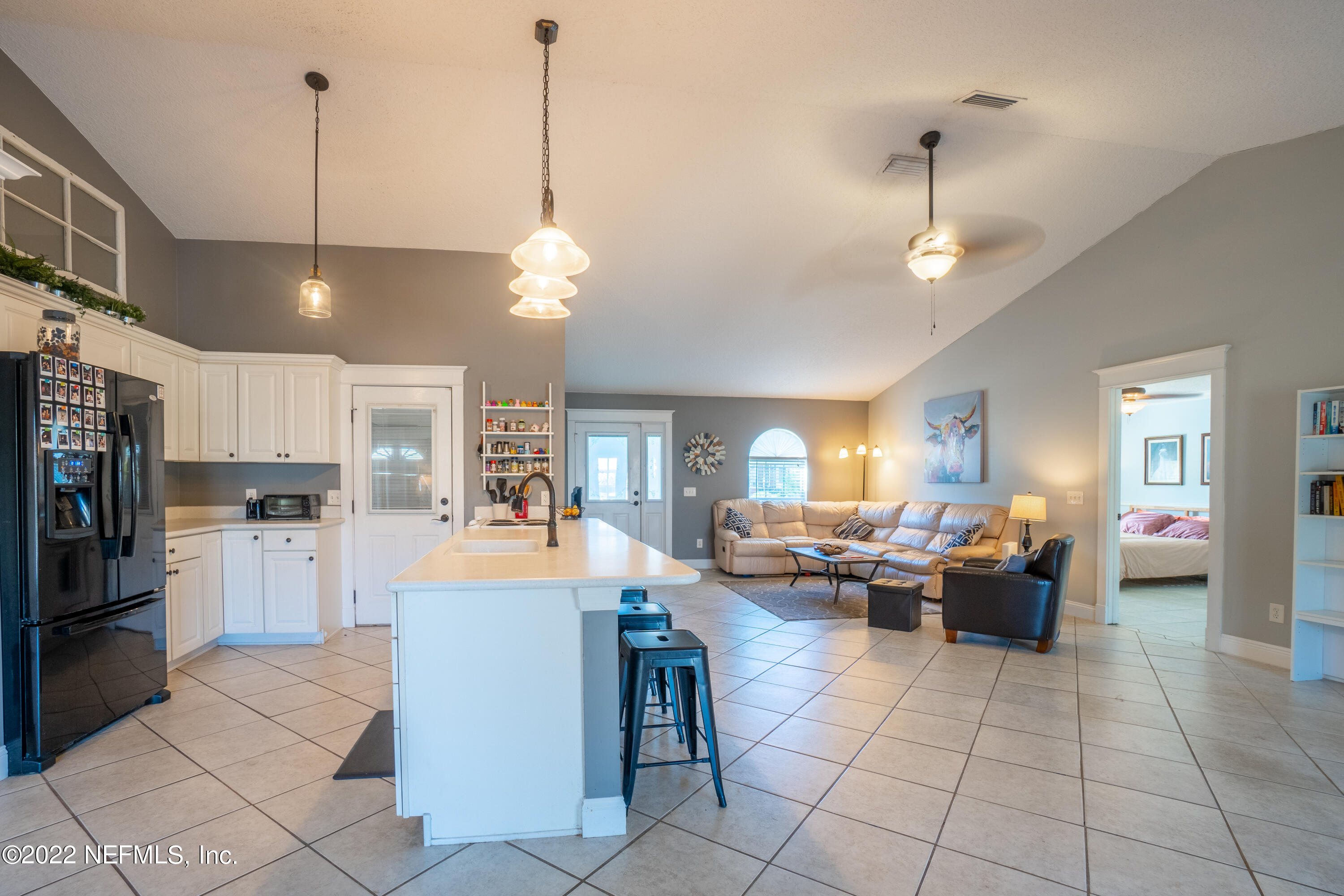 115 Nautilus Road St. Augustine, FL 32086 - Photo 12 of 23 a living room with fireplace furniture and a kitchen view