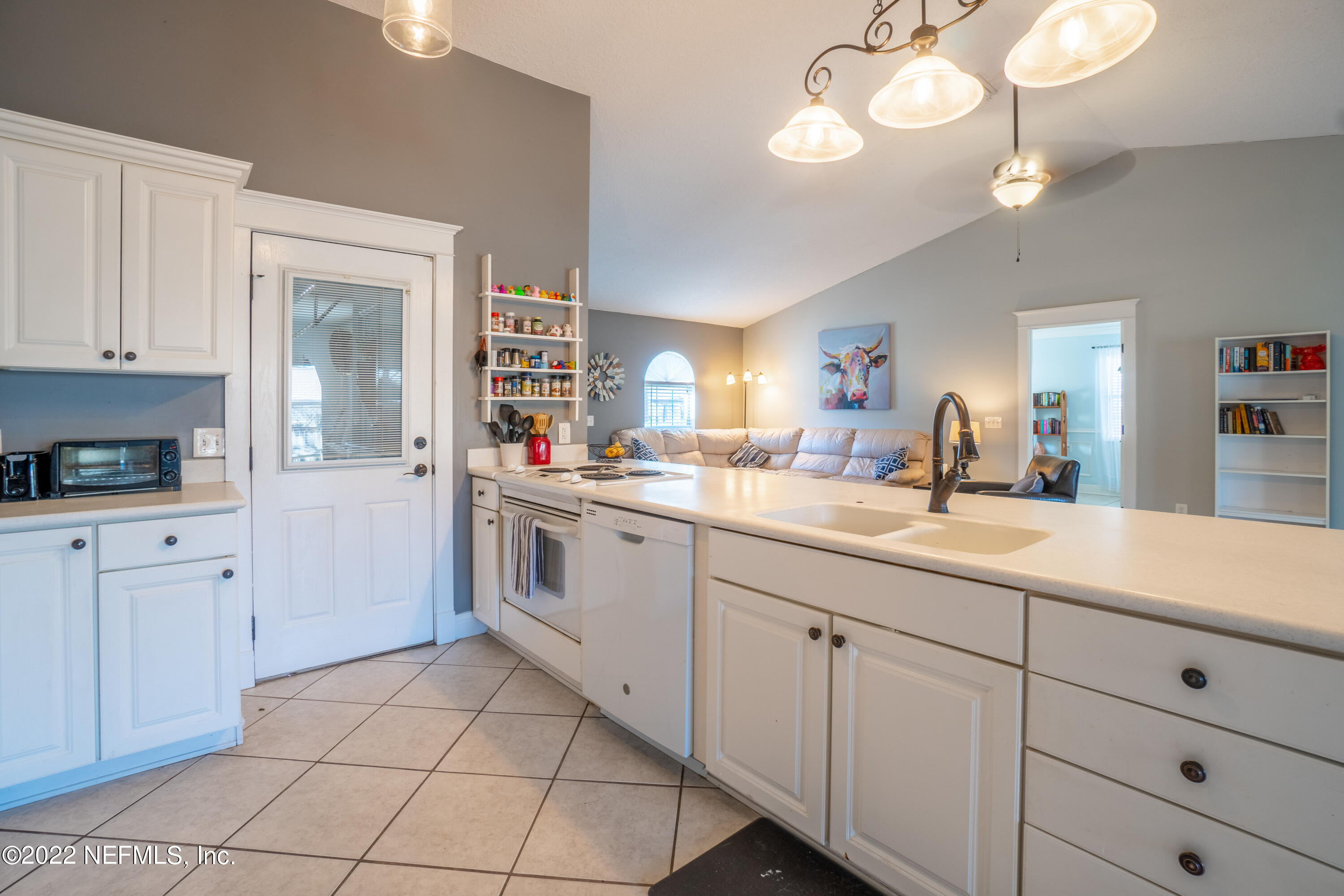 115 Nautilus Road St. Augustine, FL 32086 - Photo 13 of 23 a kitchen with cabinets and window
