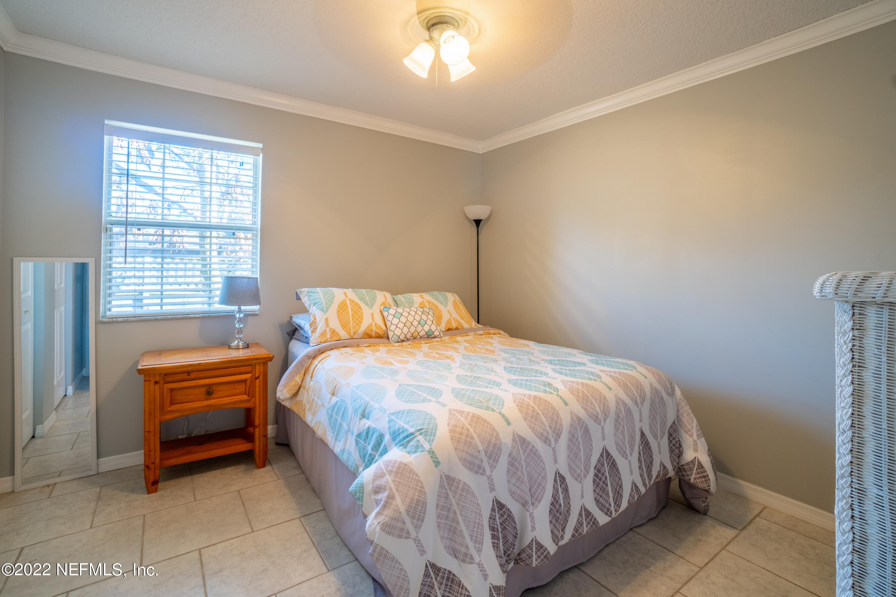 115 Nautilus Road St. Augustine, FL 32086 - Photo 16 of 23 a bedroom with a bed and a window