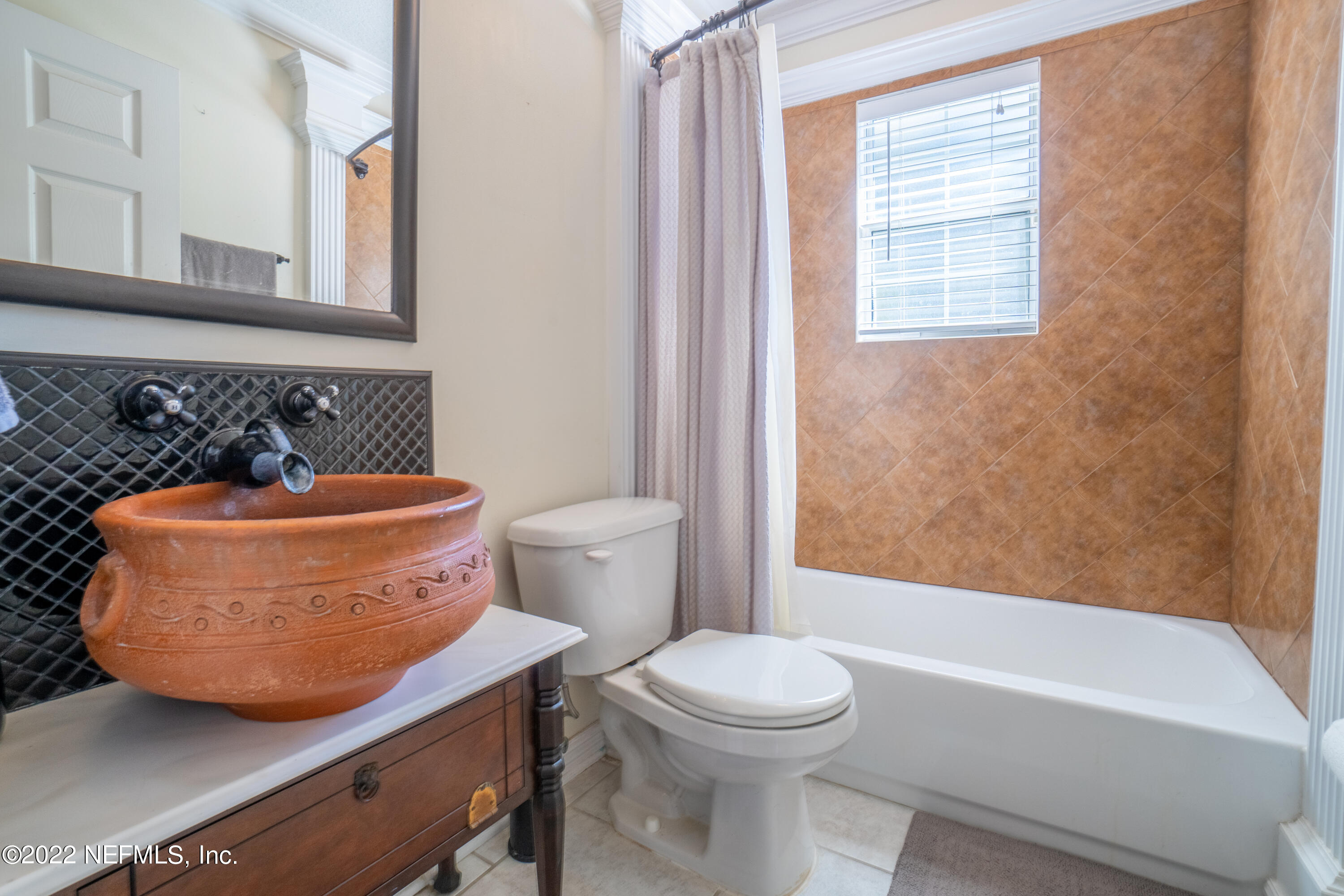 115 Nautilus Road St. Augustine, FL 32086 - Photo 17 of 23 a bathroom with a toilet a sink and a bathtub