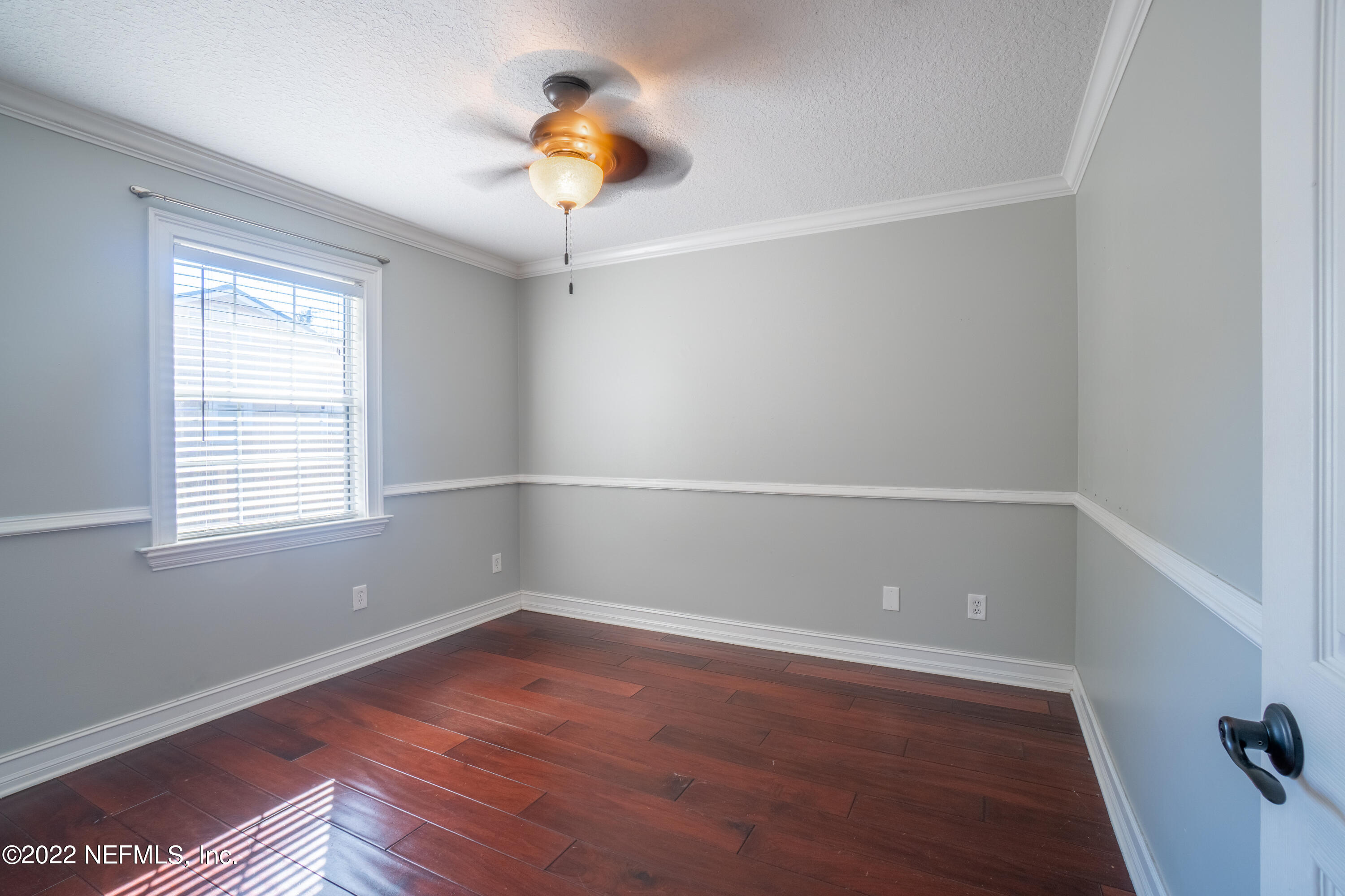 115 Nautilus Road St. Augustine, FL 32086 - Photo 18 of 23 an empty room with a window and wooden floor
