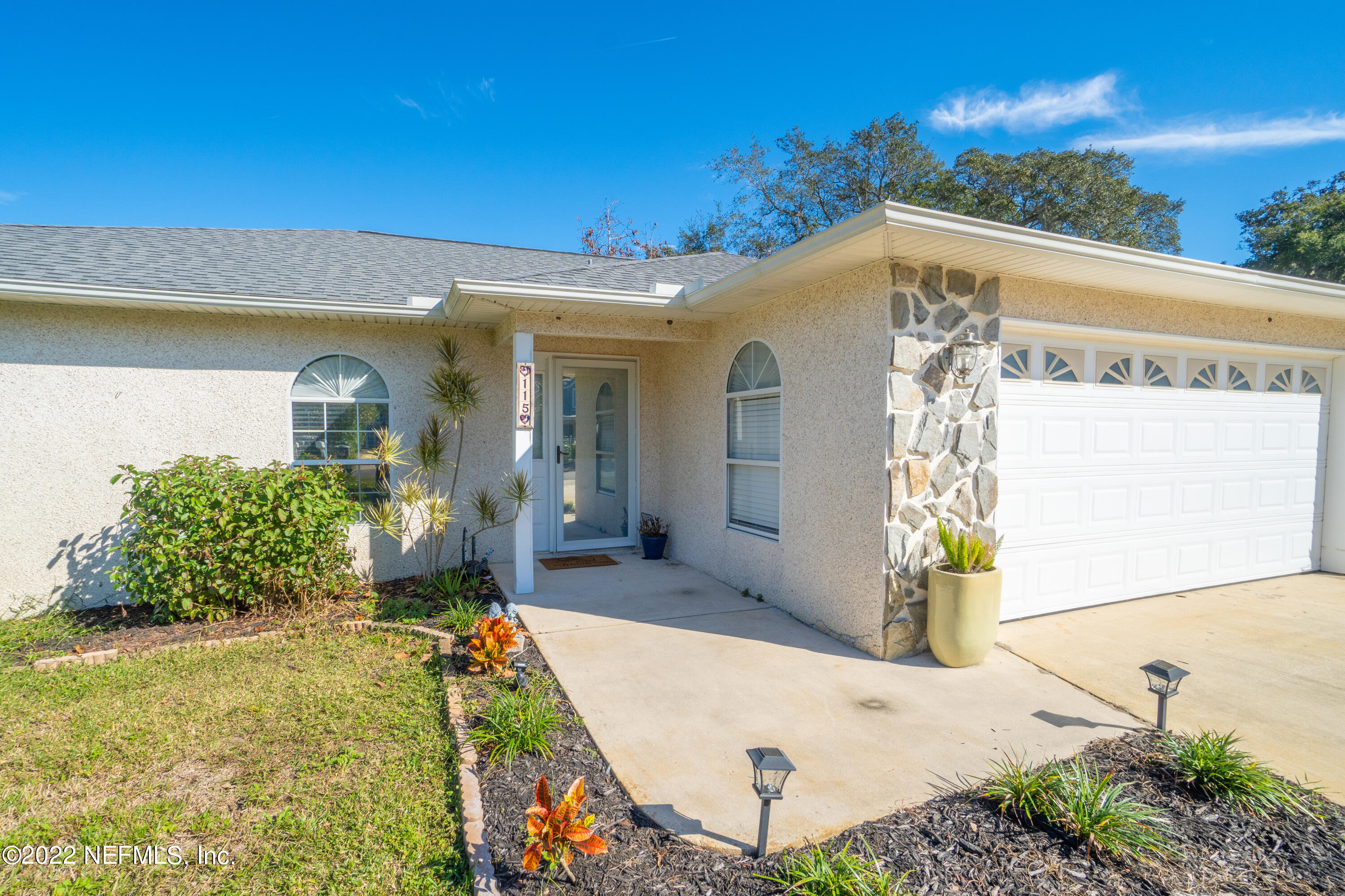 115 Nautilus Road St. Augustine, FL 32086 - Photo 23 of 23 a front view of a house with a yard