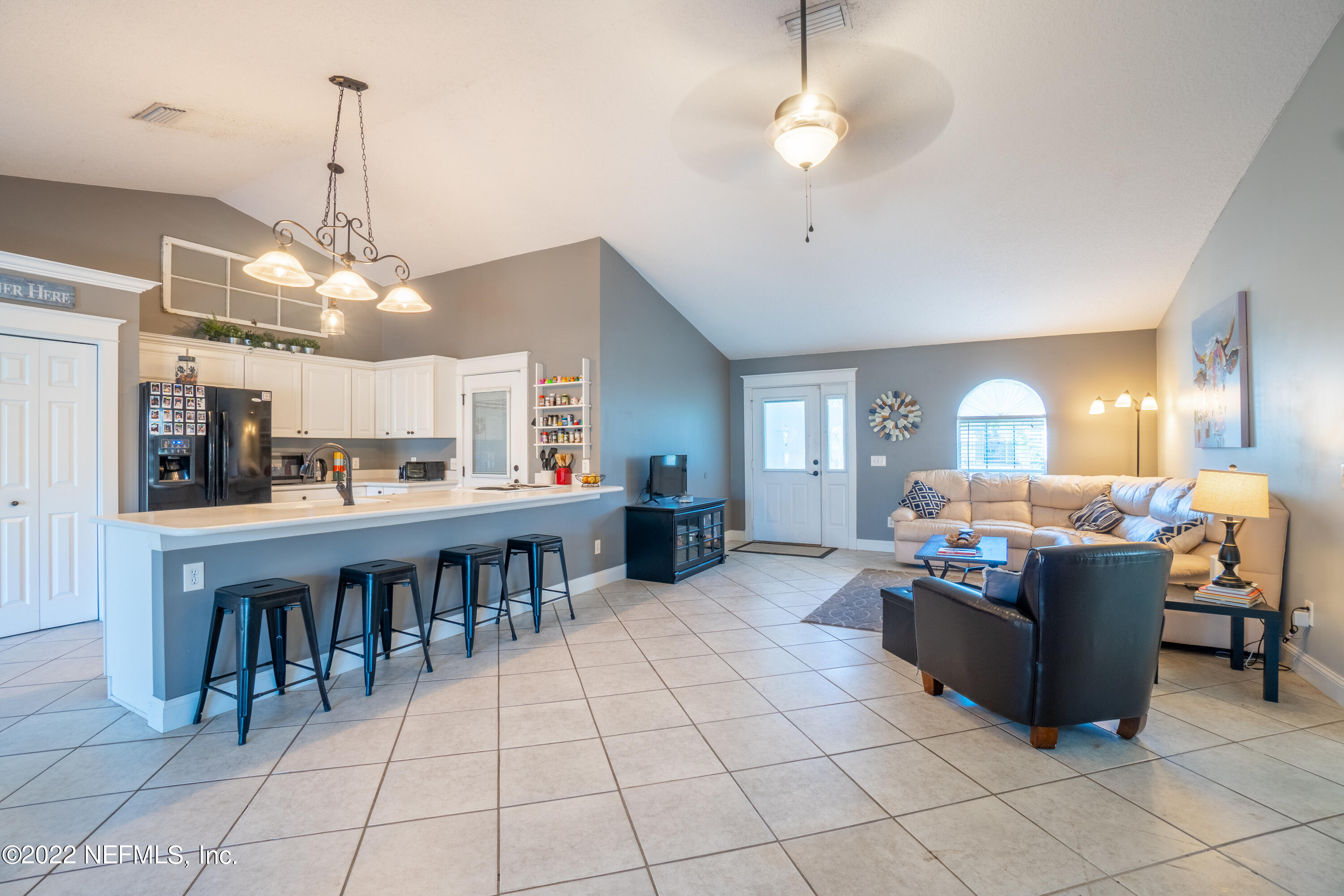 115 Nautilus Road St. Augustine, FL 32086 - Photo 6 of 23 a large kitchen with a table and chairs