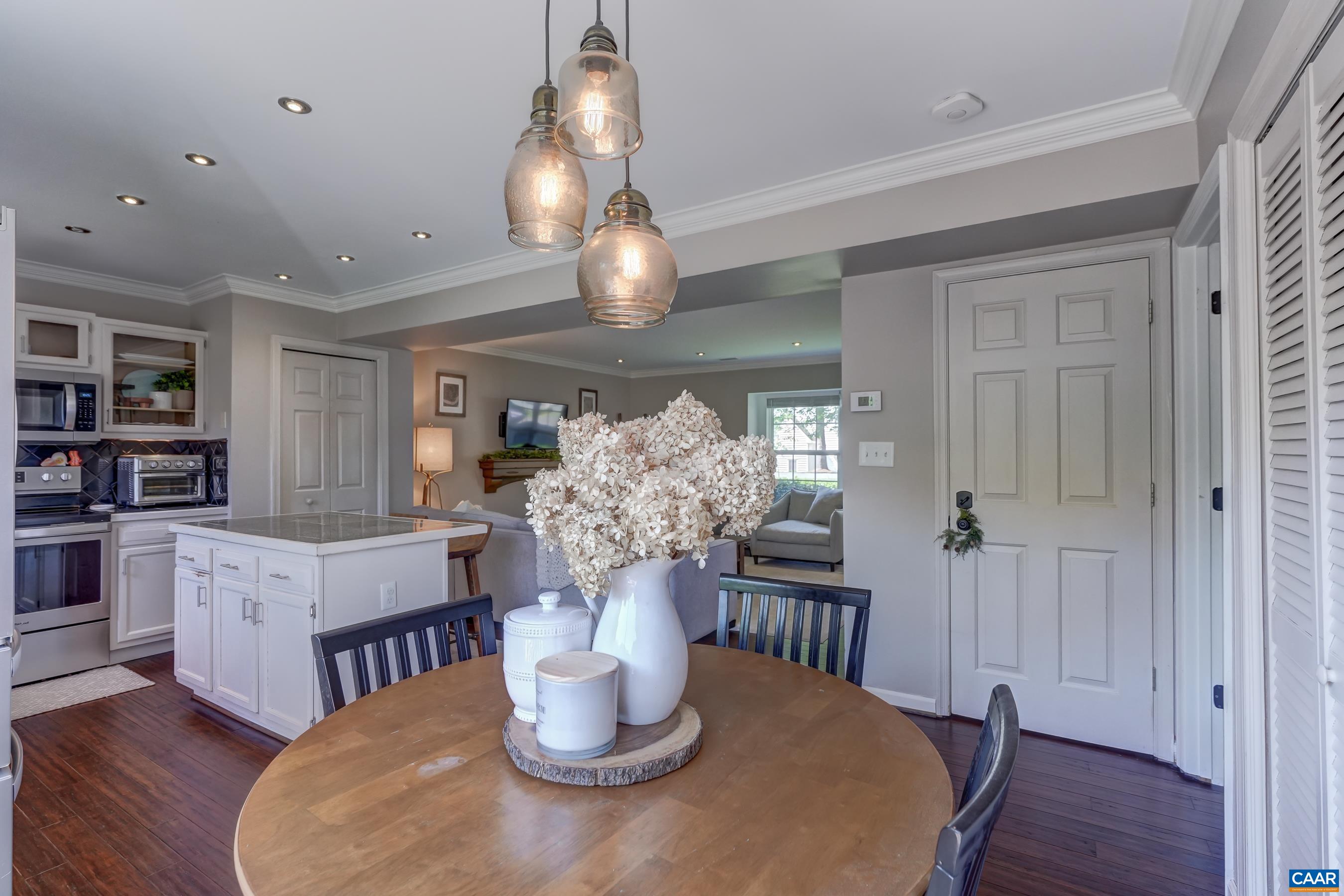 1069 Amber Ridge Road Charlottesville, VA 22901 - Photo 18 of 46 a view of a dining room with furniture window and wooden floor