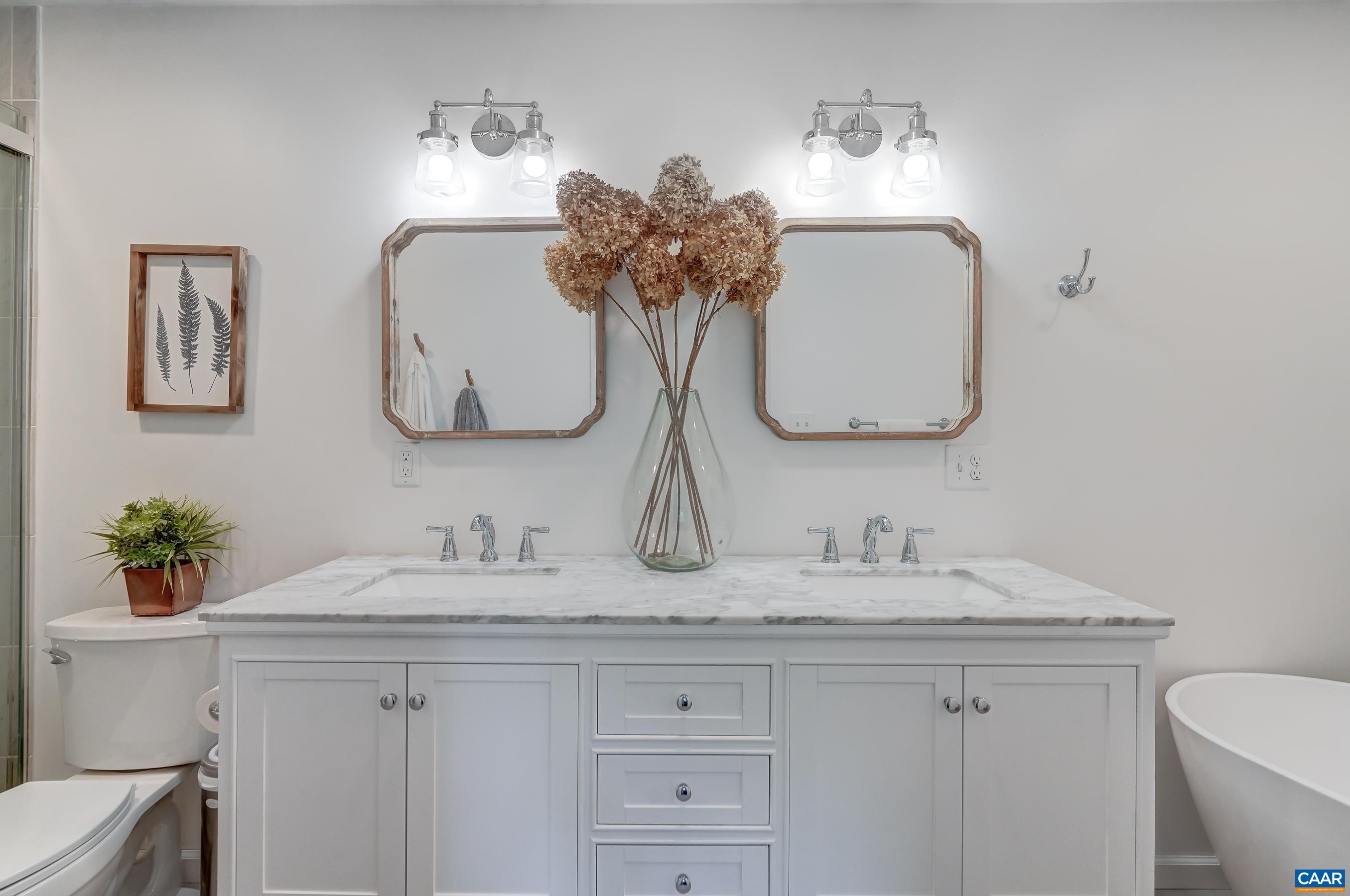 1069 Amber Ridge Road Charlottesville, VA 22901 - Photo 22 of 46 a bathroom with a sink double vanity and a mirror