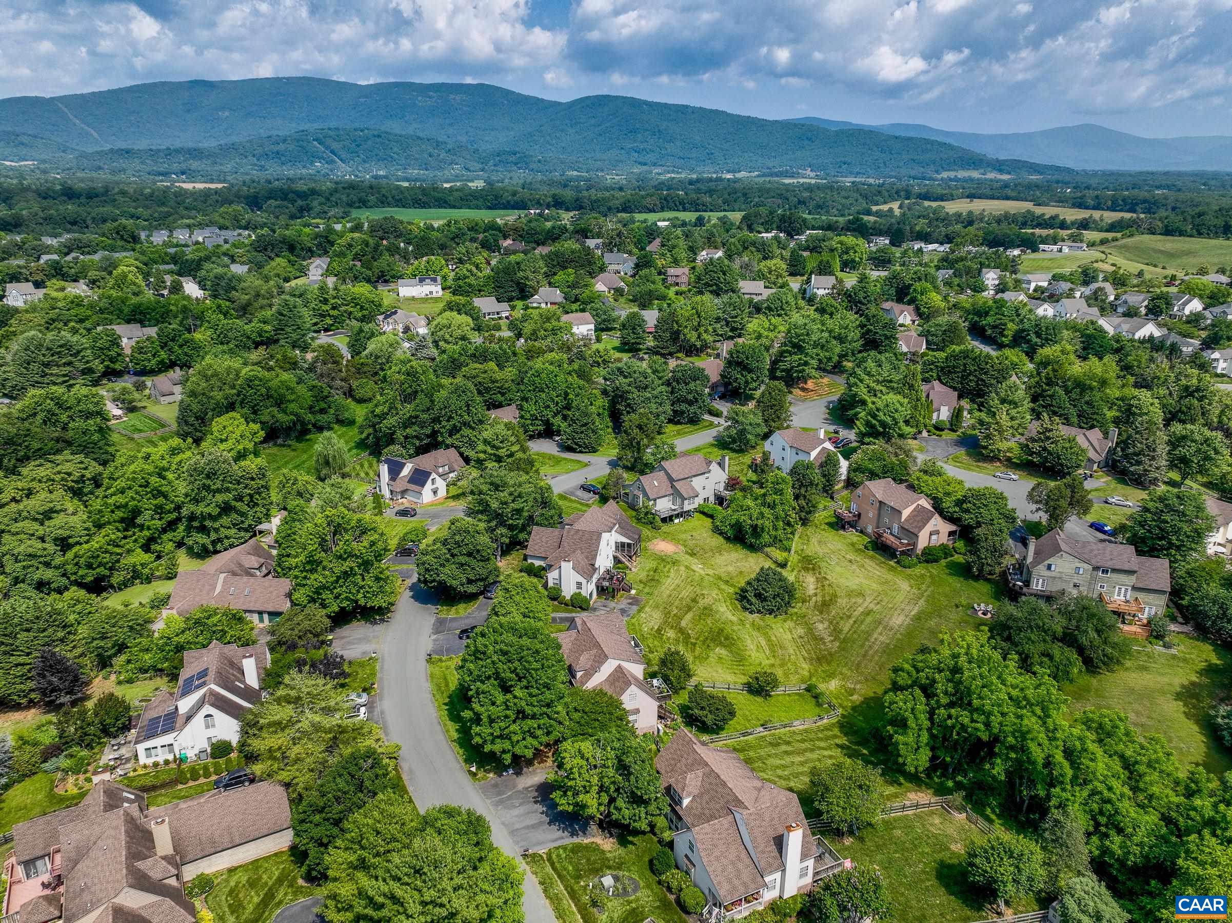 1069 Amber Ridge Road Charlottesville, VA 22901 - Photo 4 of 46 an aerial view of residential houses with outdoor space and trees