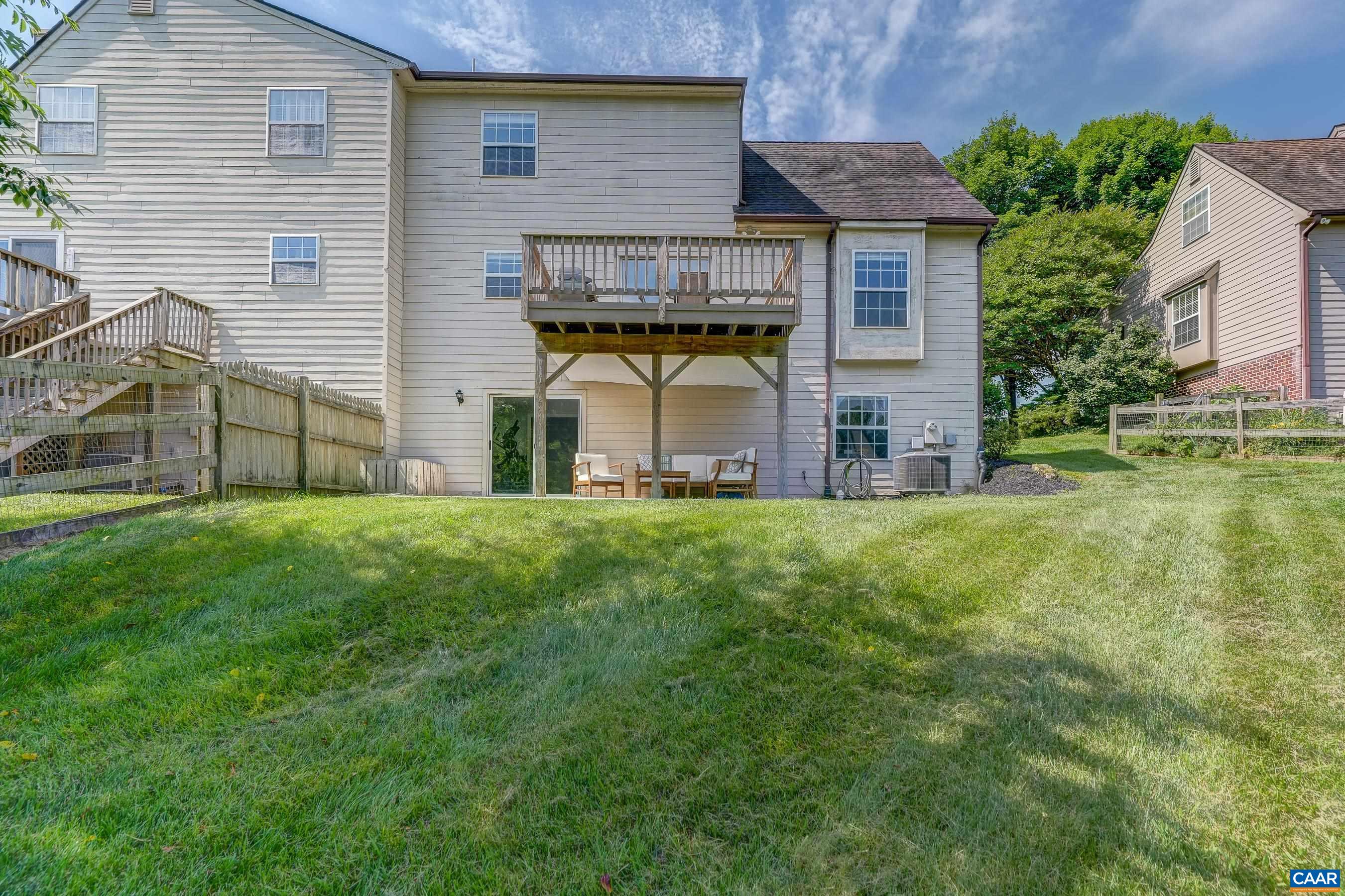 1069 Amber Ridge Road Charlottesville, VA 22901 - Photo 42 of 46 a view of a house with a big yard and large tree