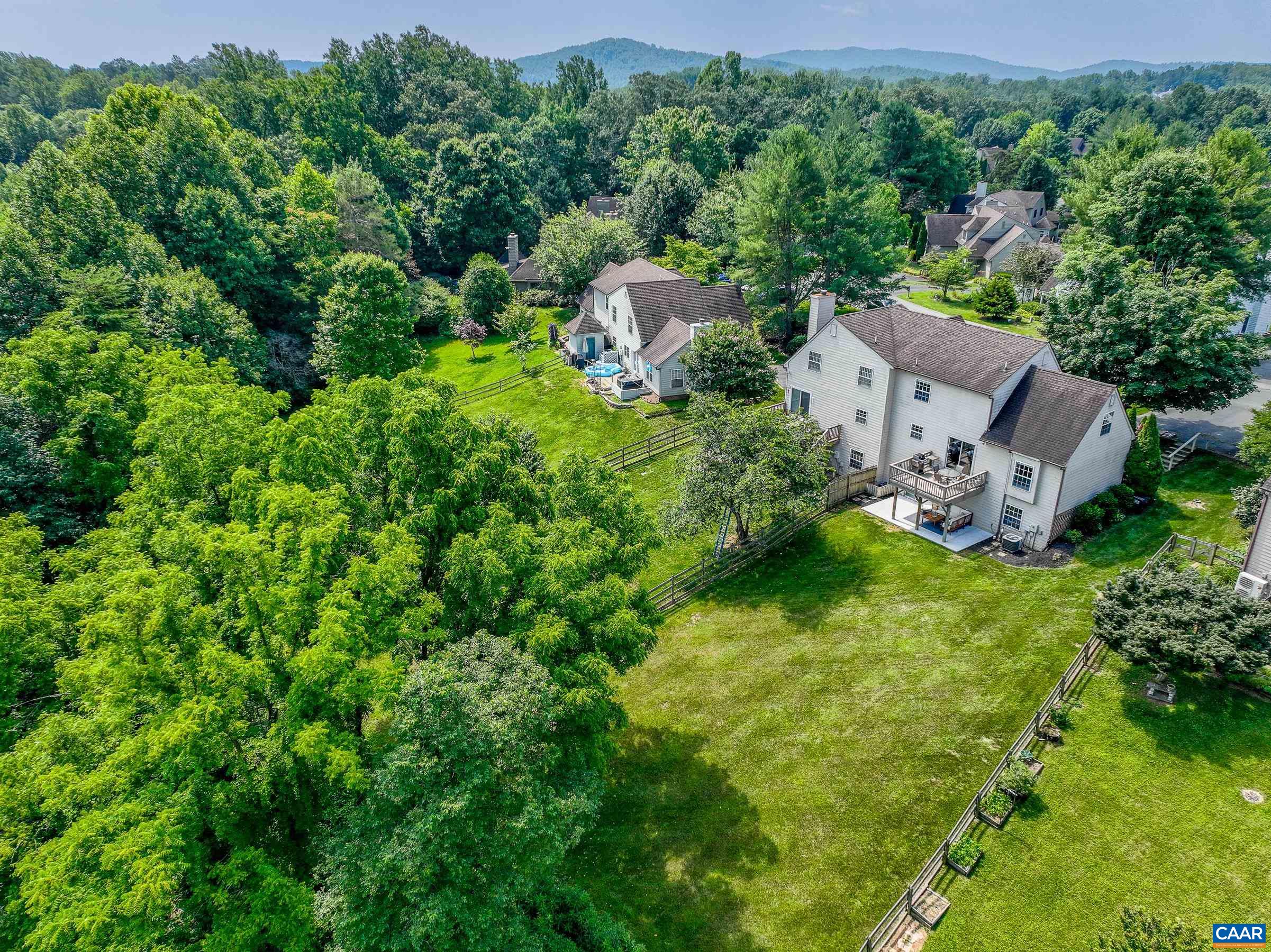 1069 Amber Ridge Road Charlottesville, VA 22901 - Photo 45 of 46 an aerial view of a house with a yard