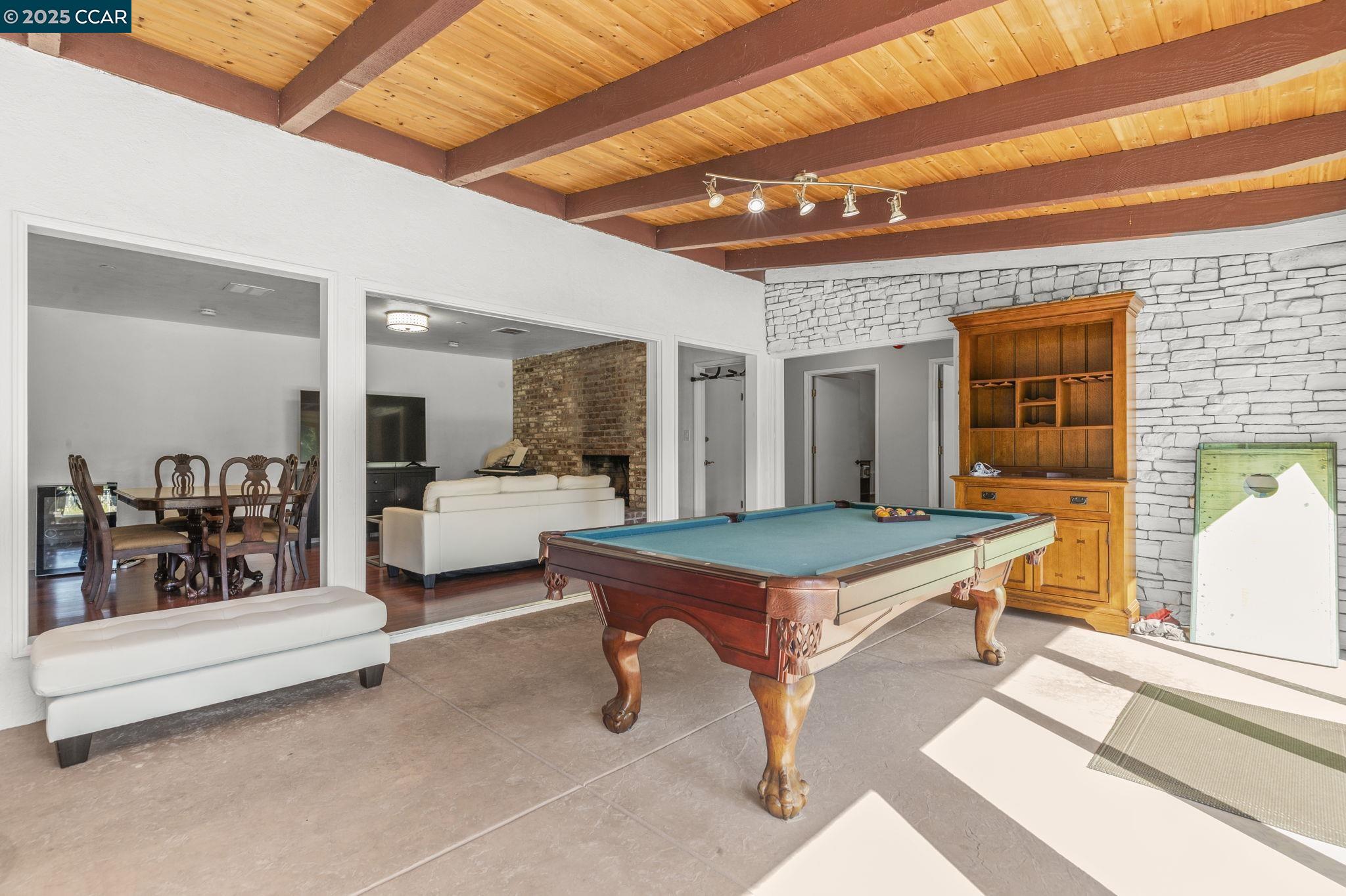 1910 San Miguel Drive Walnut Creek, CA 94596 - Photo 13 of 58 a room with pool table and glass door