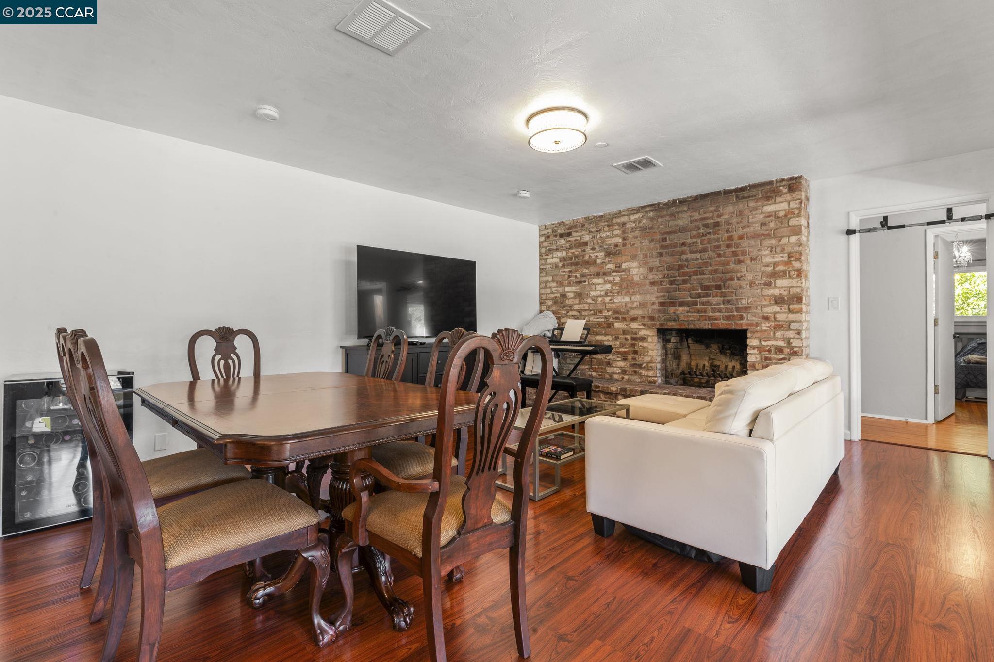 1910 San Miguel Drive Walnut Creek, CA 94596 - Photo 14 of 58 a living room with furniture a fireplace and a flat screen tv