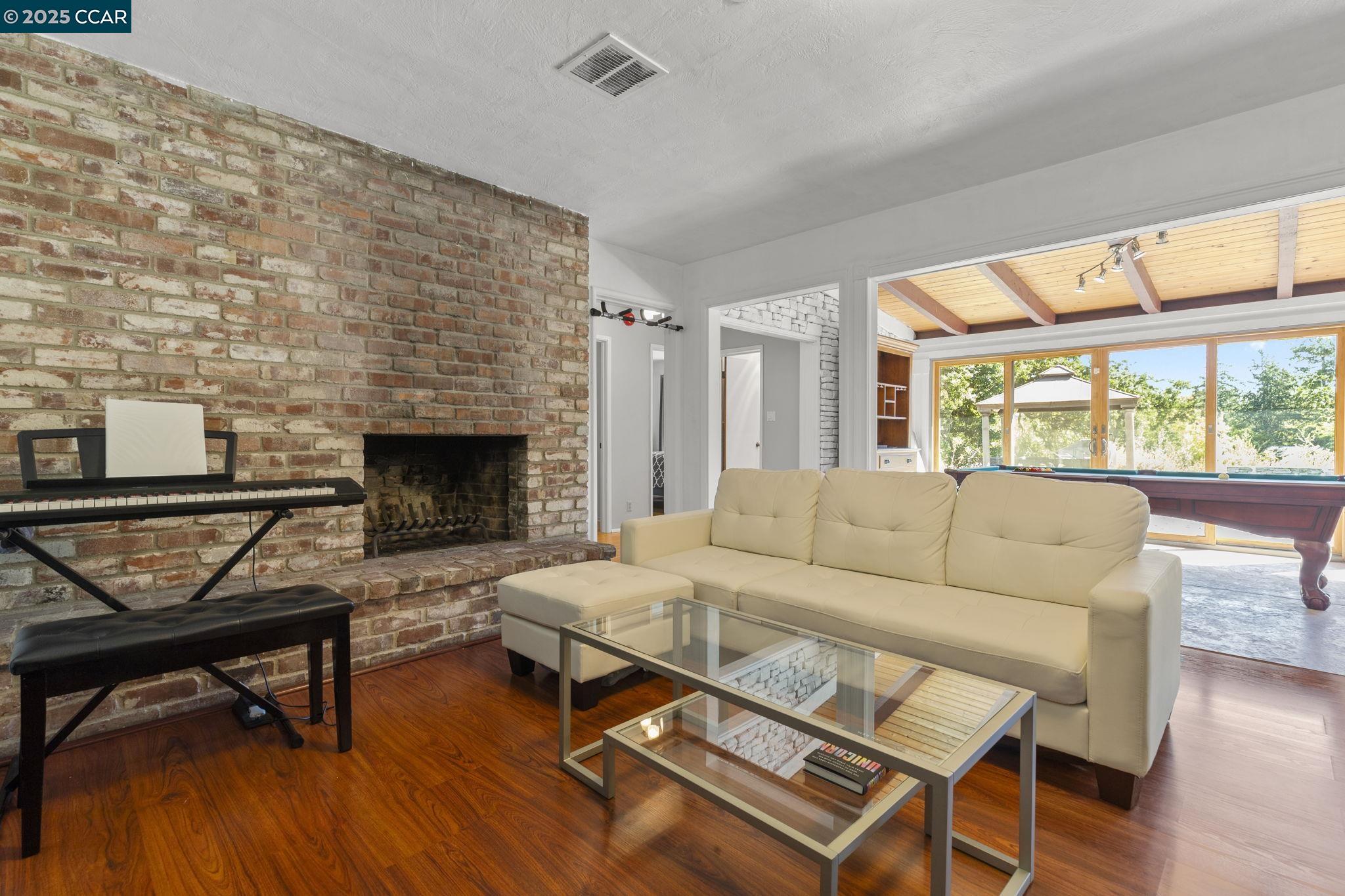 1910 San Miguel Drive Walnut Creek, CA 94596 - Photo 15 of 58 a living room with furniture and a fireplace