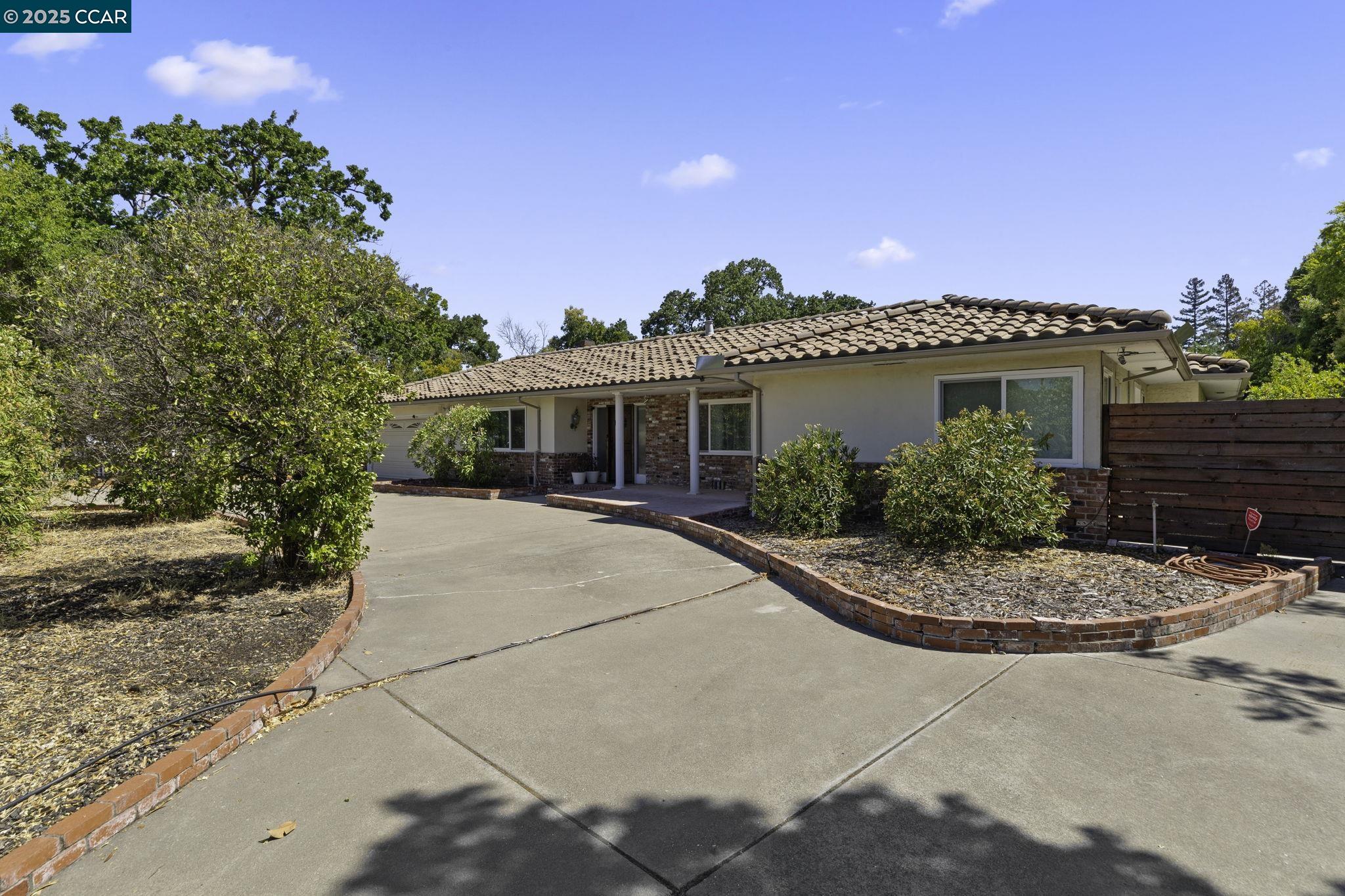 1910 San Miguel Drive Walnut Creek, CA 94596 - Photo 2 of 58 a view of a house with a patio