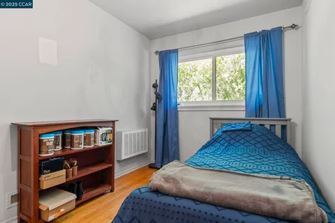 a utility room with dryer washer and shoe rack