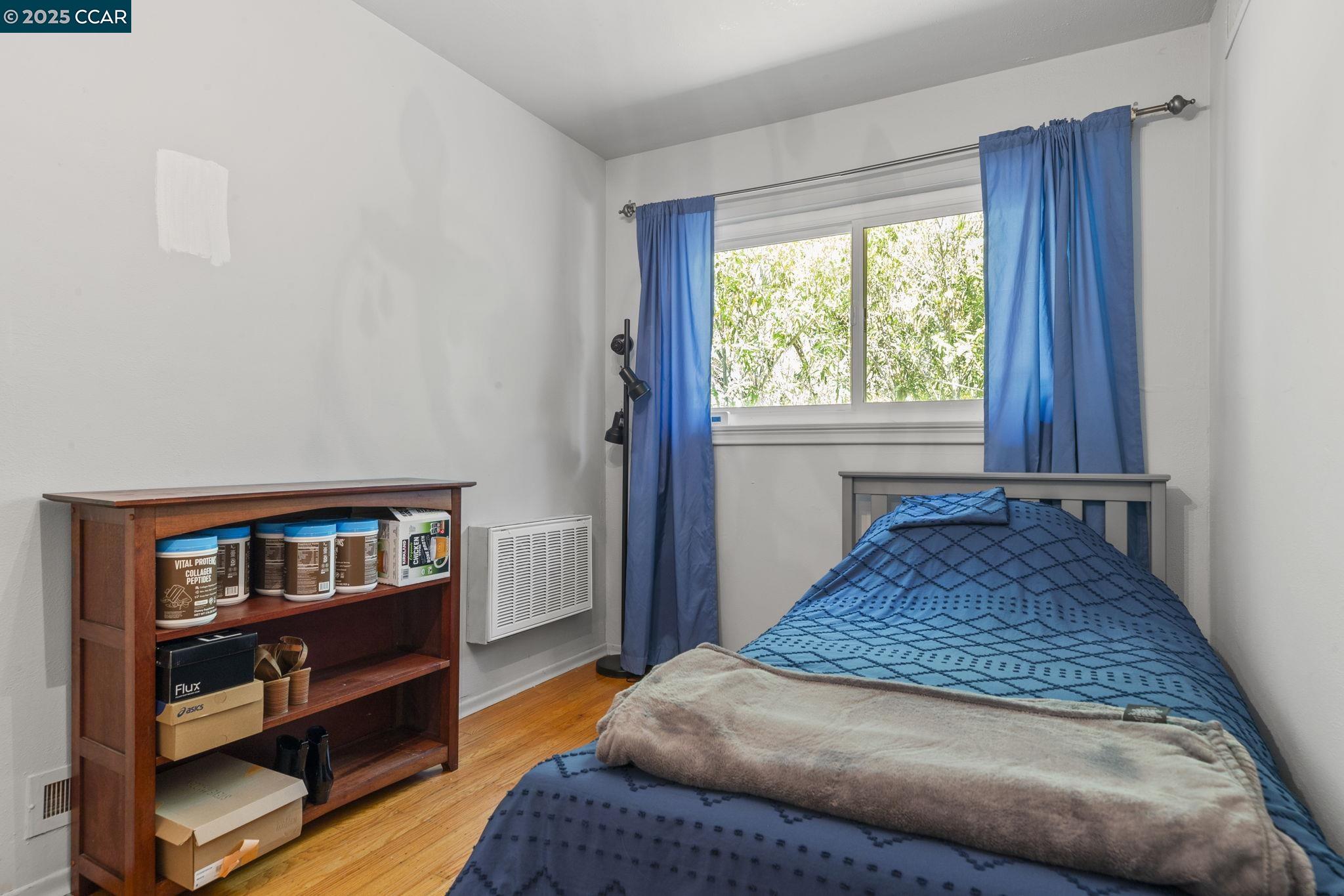 1910 San Miguel Drive Walnut Creek, CA 94596 - Photo 28 of 58 a bed sitting in a bedroom next to a window