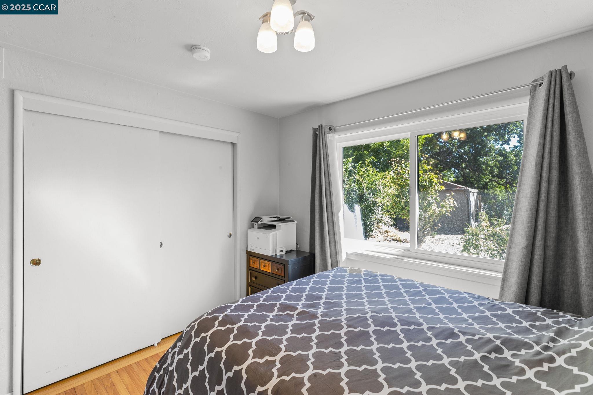 1910 San Miguel Drive Walnut Creek, CA 94596 - Photo 30 of 58 a bedroom with a bed and a window