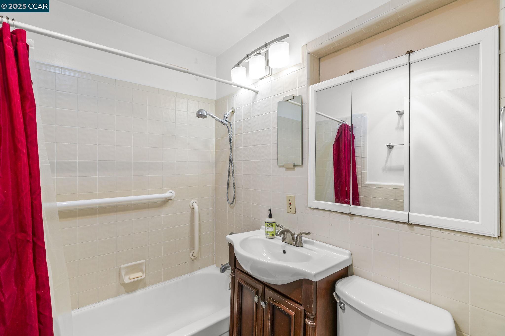 1910 San Miguel Drive Walnut Creek, CA 94596 - Photo 31 of 58 a bathroom with a sink and a mirror