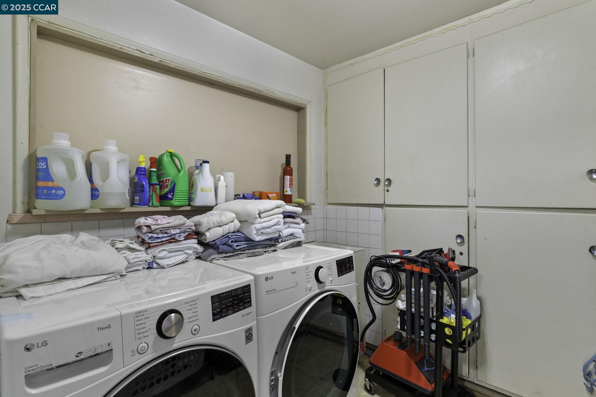 1910 San Miguel Drive Walnut Creek, CA 94596 - Photo 32 of 58 a utility room with dryer washer and shoe rack