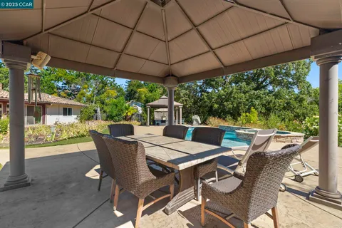 an aerial view of residential house with outdoor space and parking